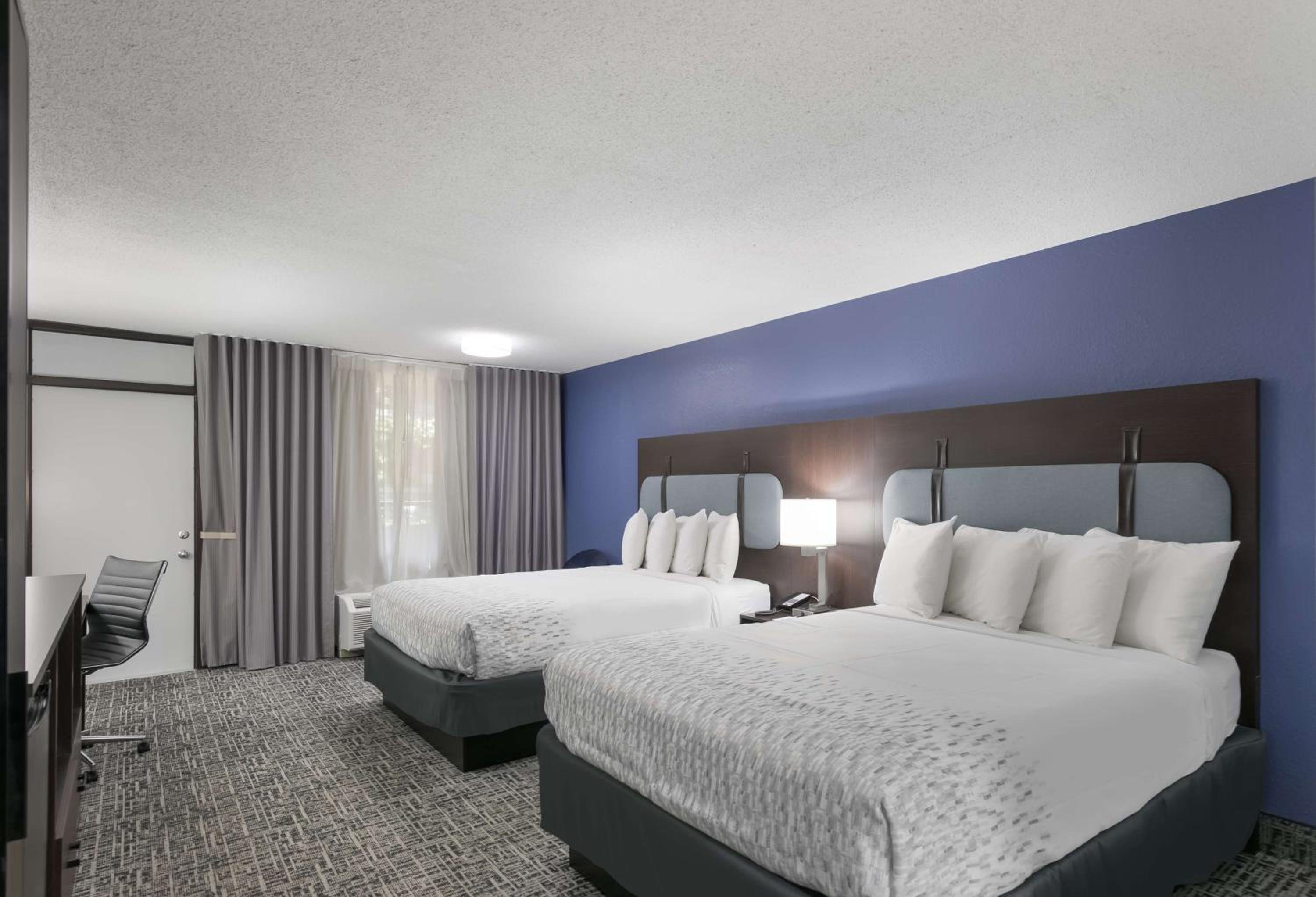 Queen Room with Two Queen Beds with Balcony - Photo 1