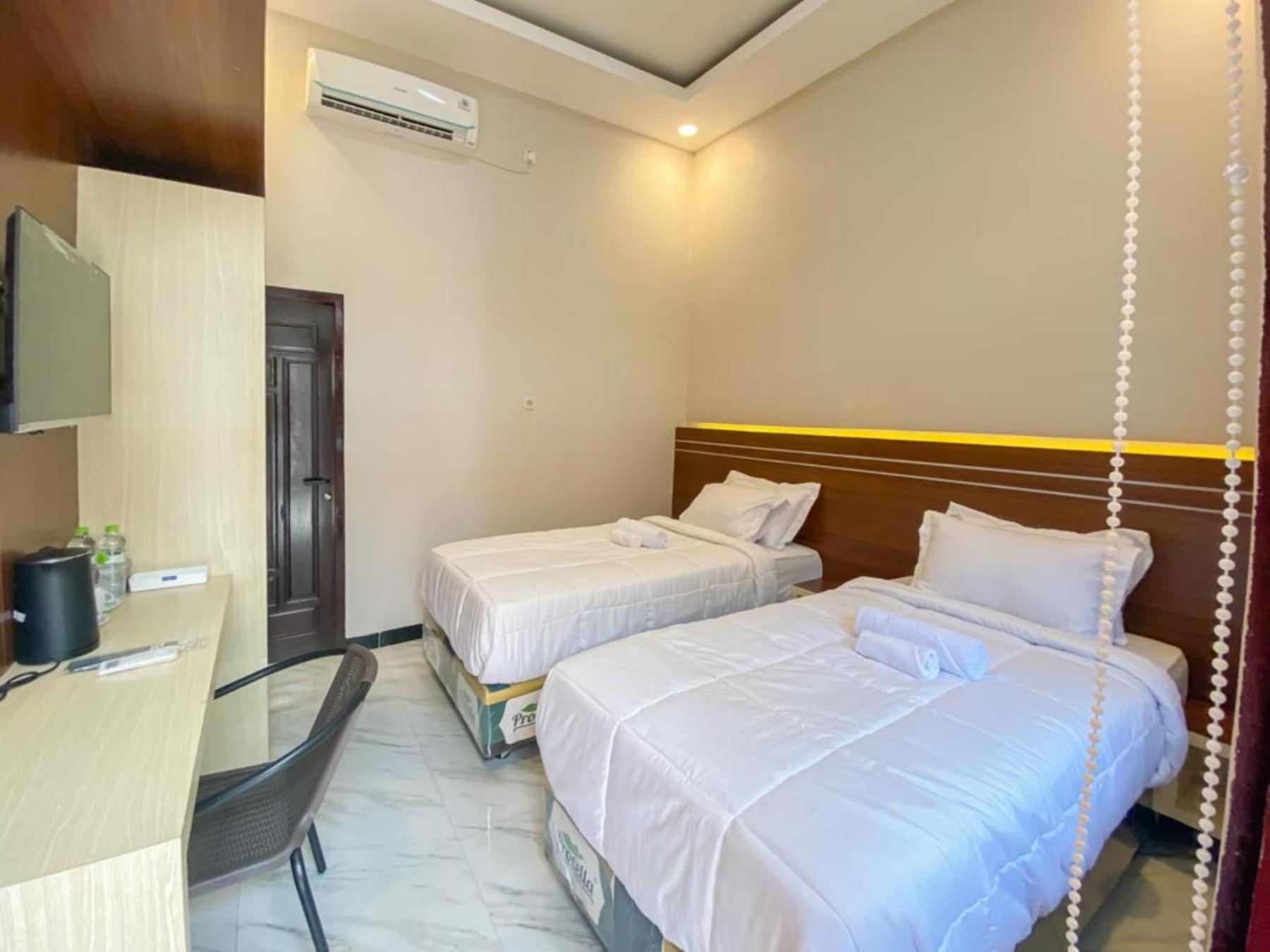 Standard Twin Room - Photo 4
