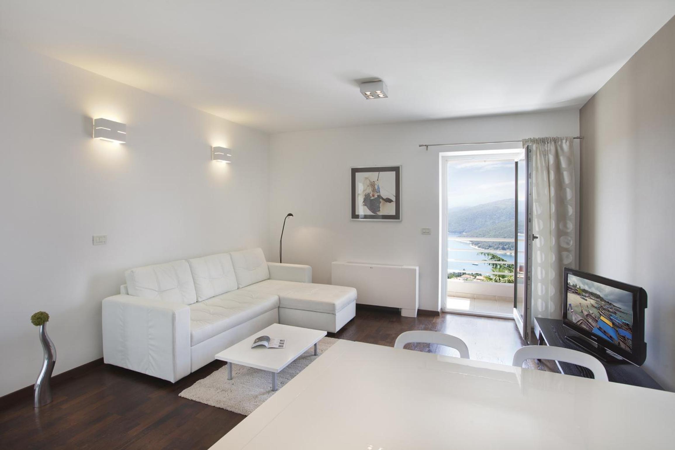 One-Bedroom Apartment with Balcony and Sea View