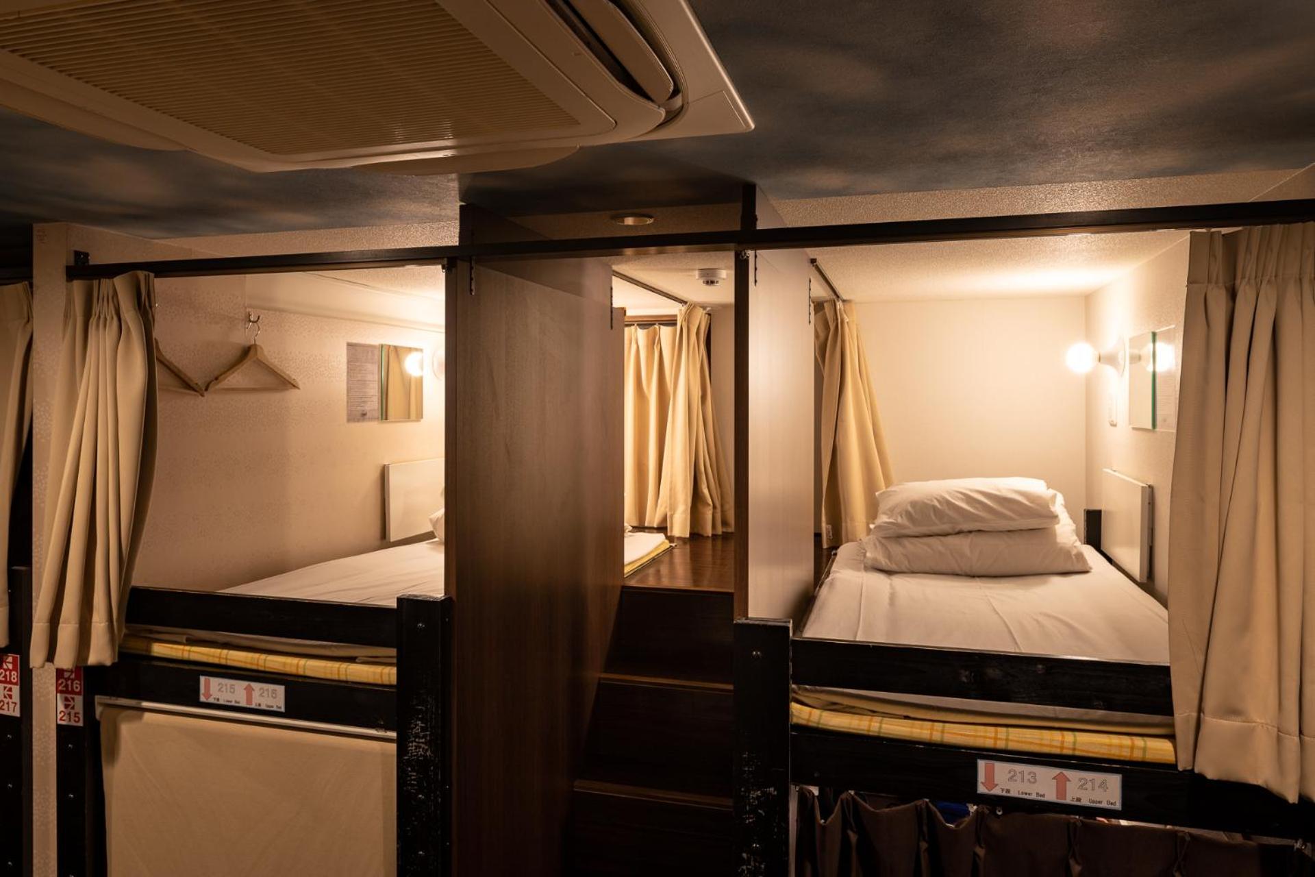 Set of 2 Upper Bunk Beds in Female Dormitory Room	 photo 2