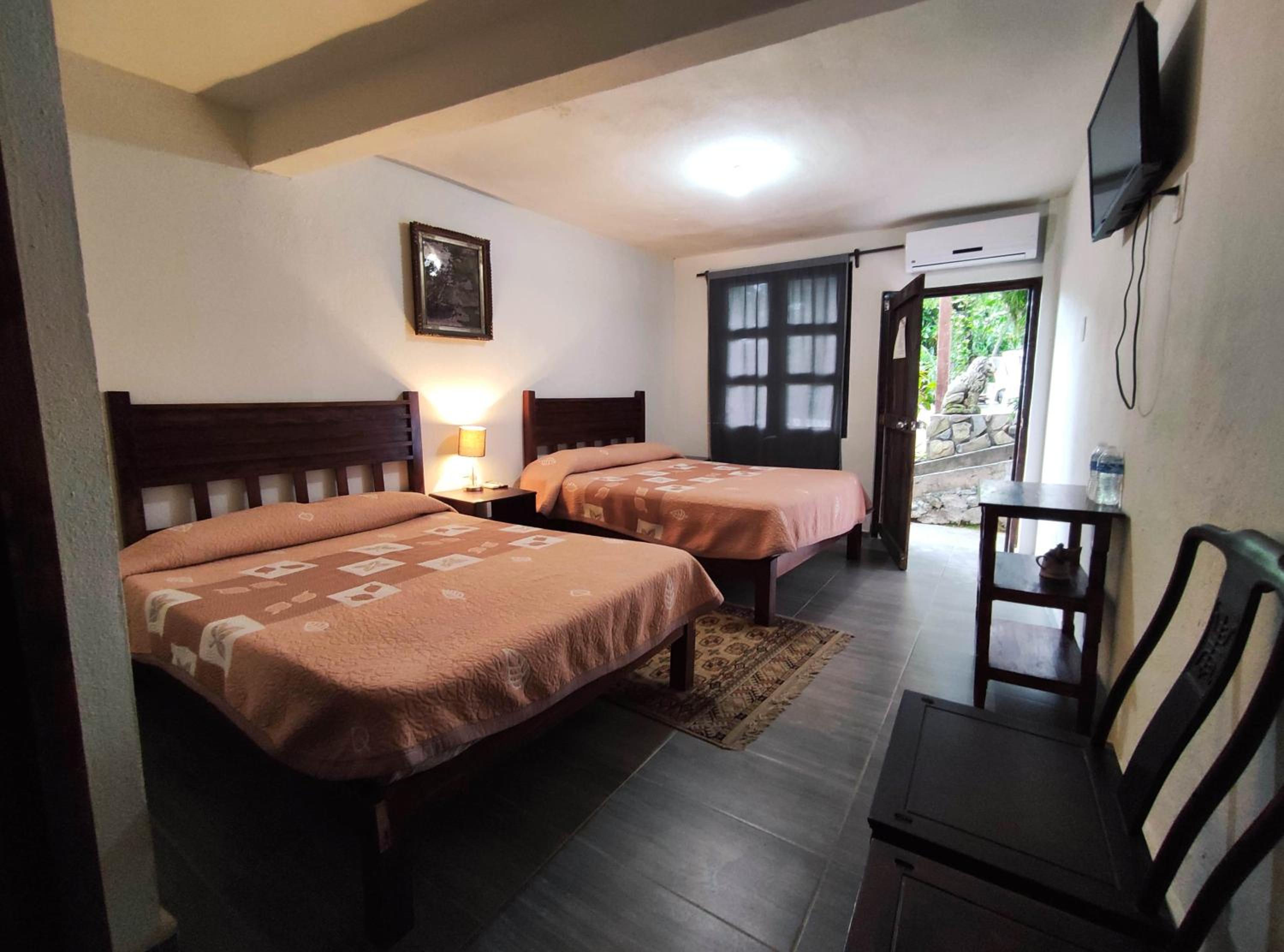 Superior Queen Room with Two Queen Beds - Photo 1