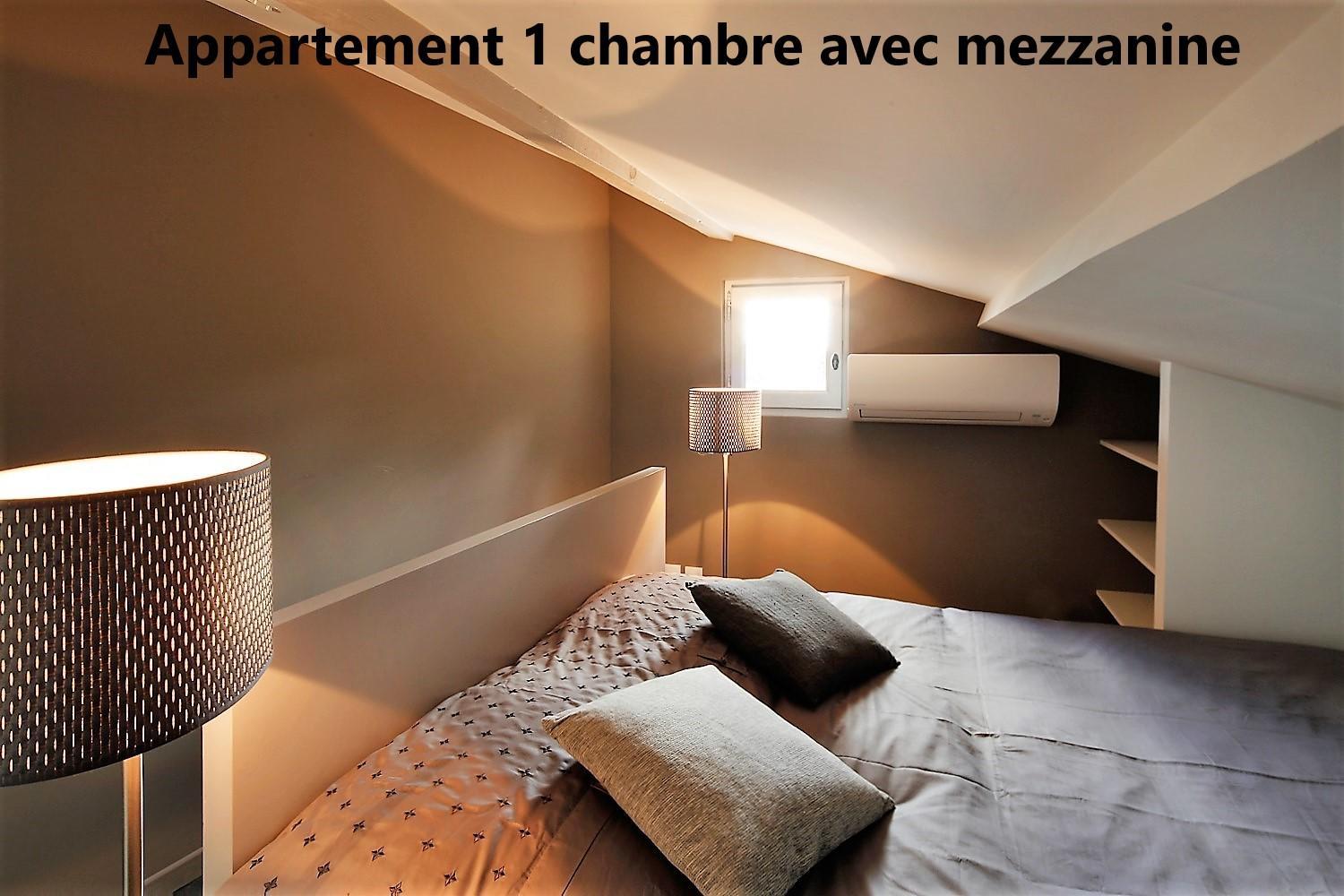 One-Bedroom Apartment with Mezzanine - Photo 3