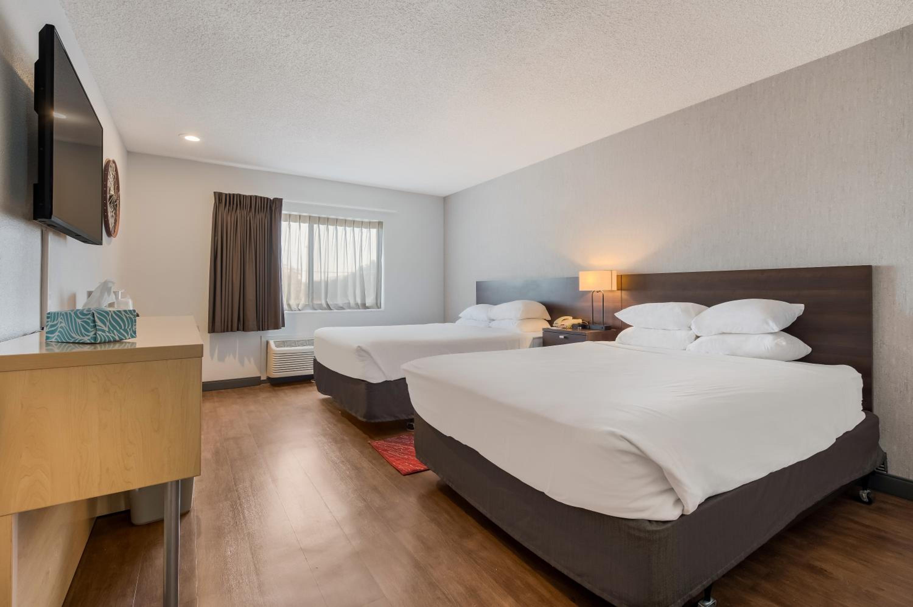 Queen Room with Two Queen Beds - Photo 1