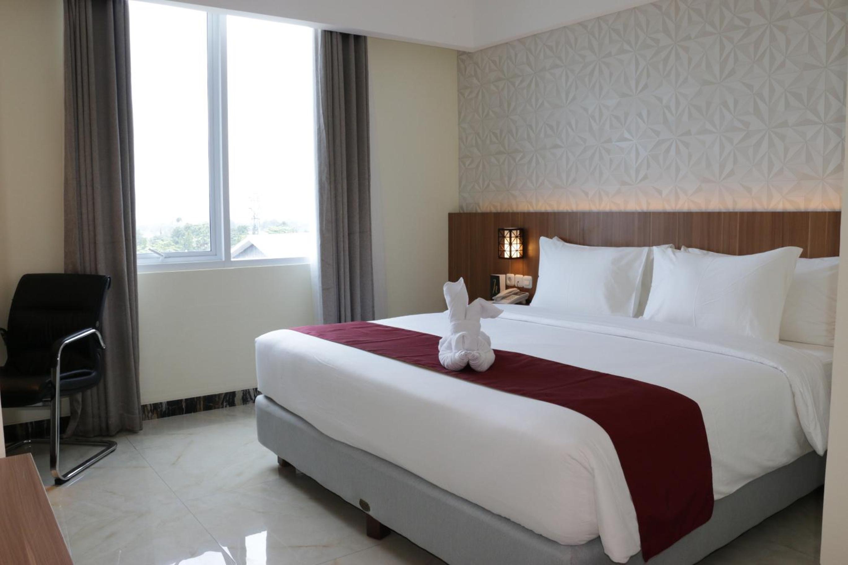 Deluxe Room - Photo 16