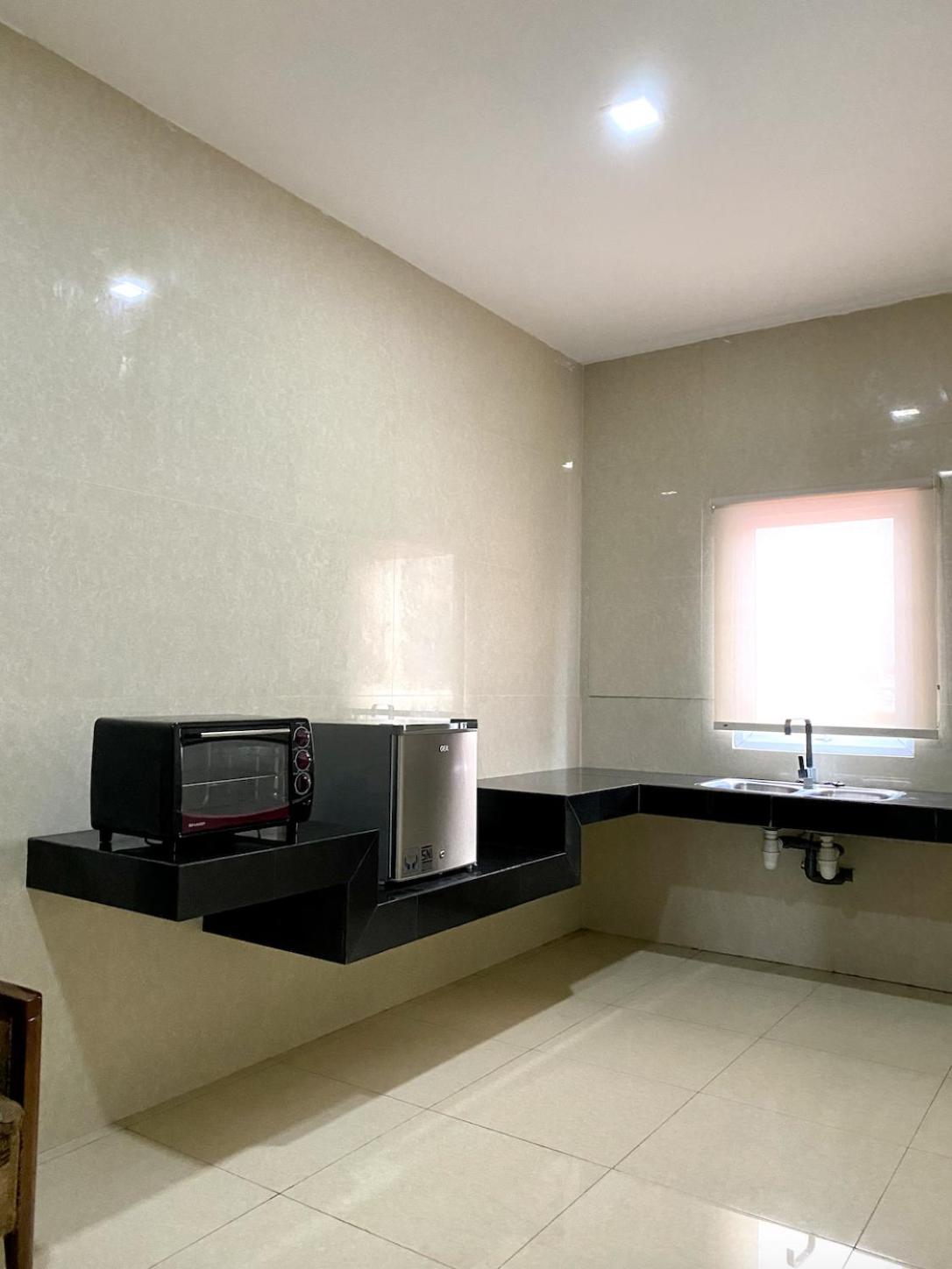 Three-Bedroom Apartment - Photo 11