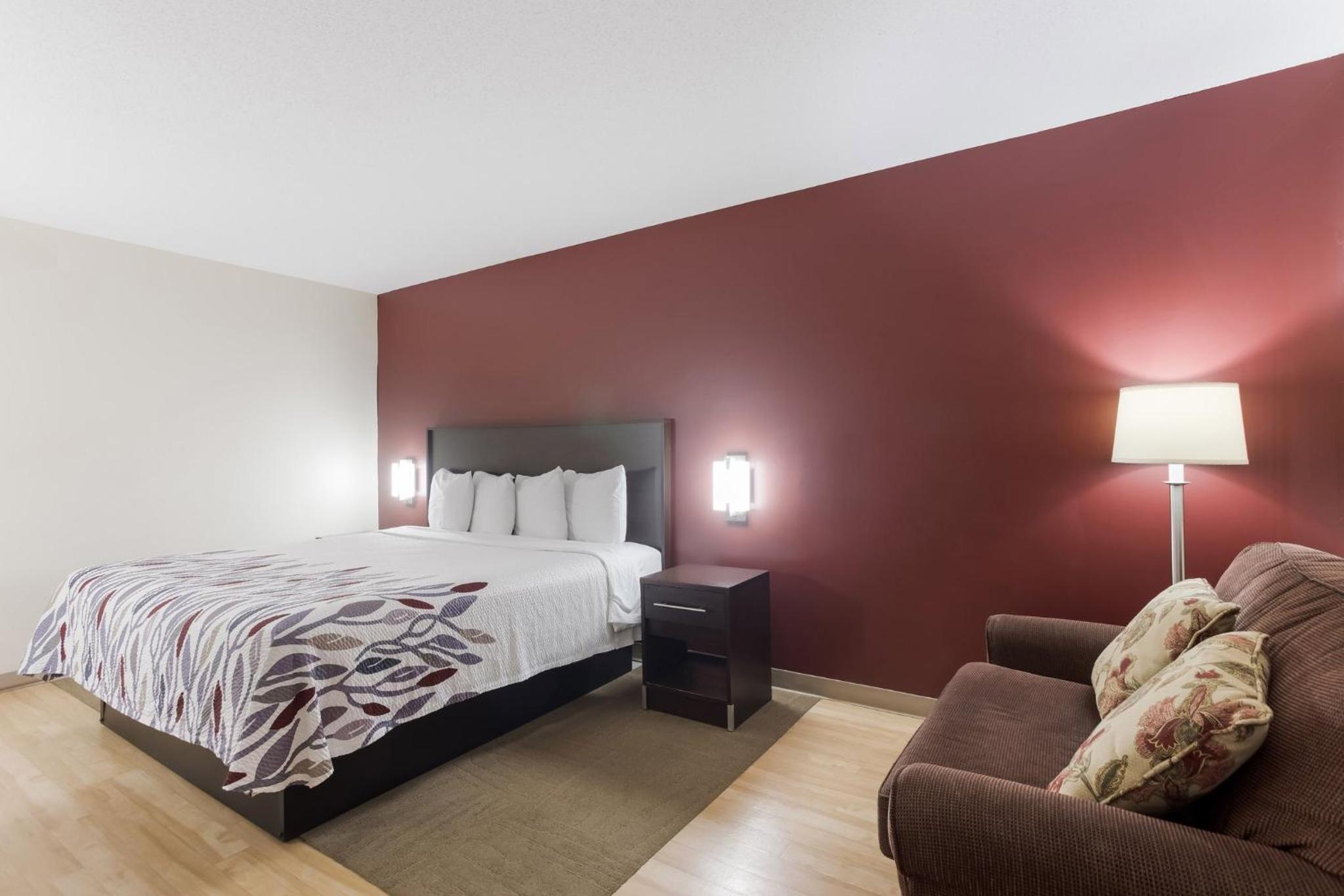 hotel room with a king size bed and a sofa