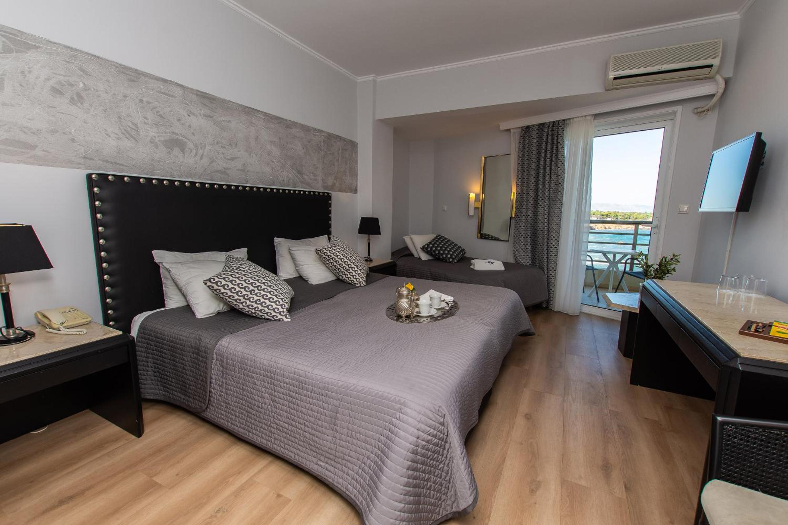 Dreibettzimmer mit Meerblick