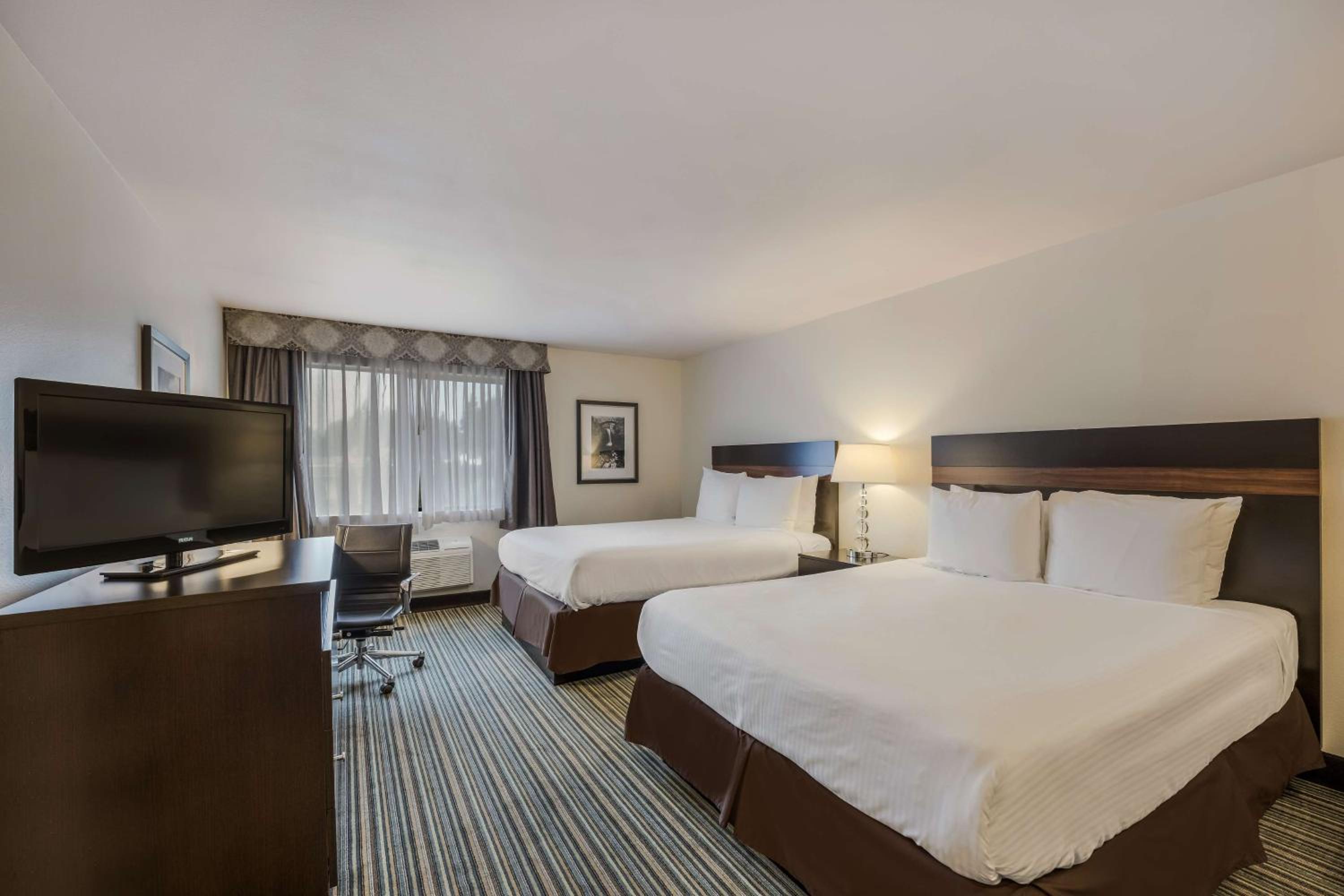 Queen Room with Two Queen Beds - Photo 1