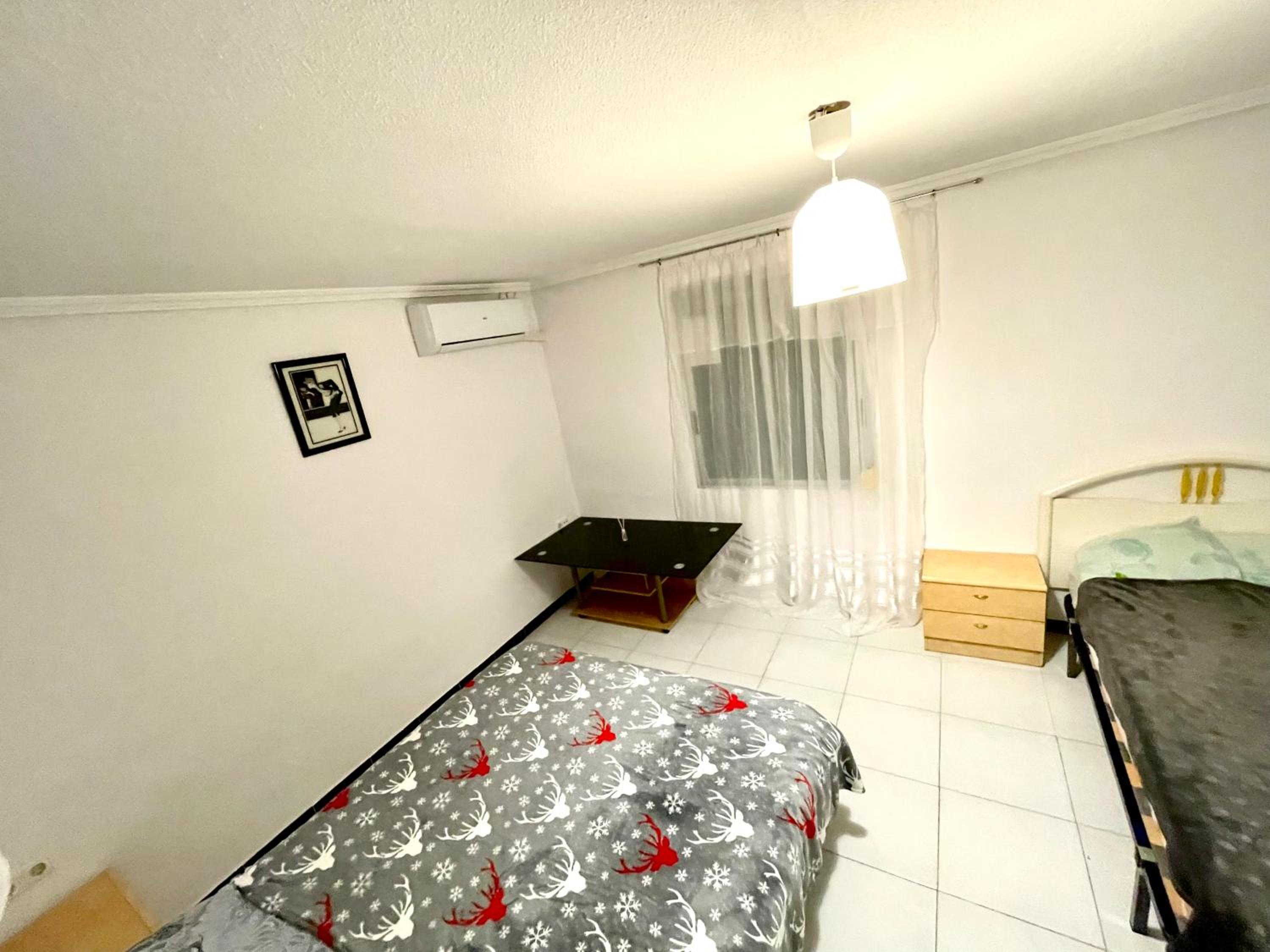 Habitación Triple Básica con Baño Compartido