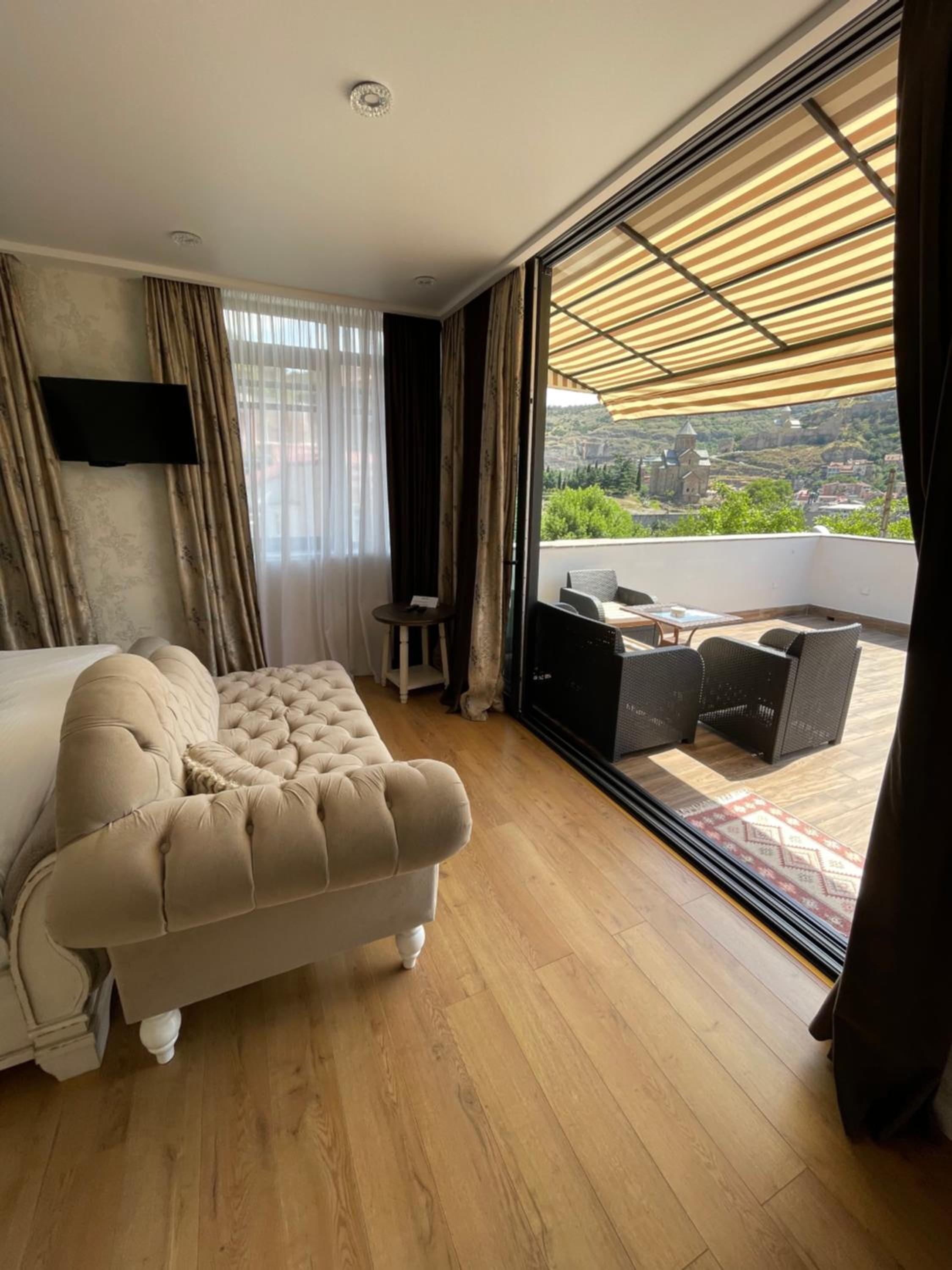 King Suite with Balcony - Photo 1