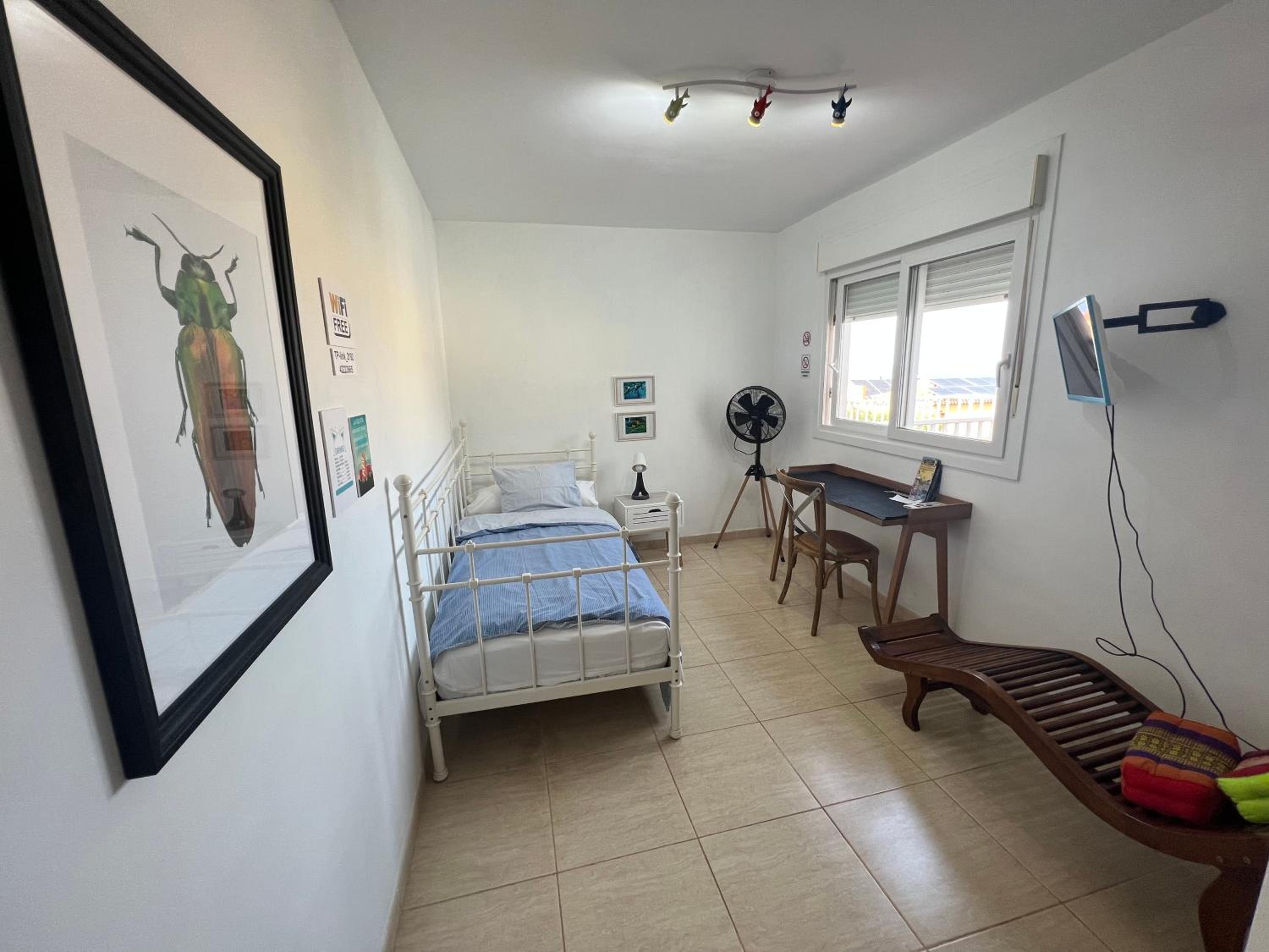 Habitación individual con baño compartido