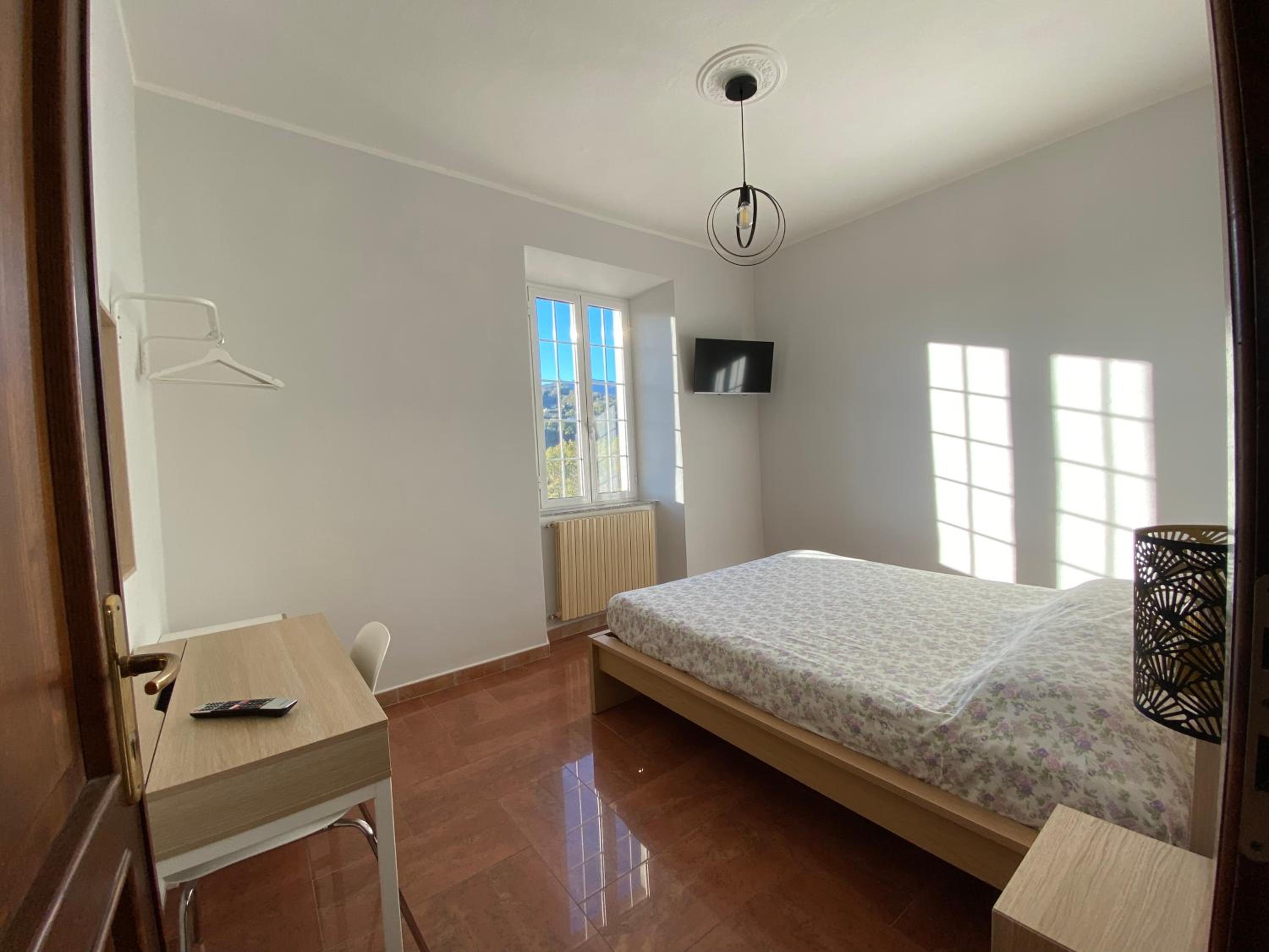 Three-Bedroom House - Photo 25