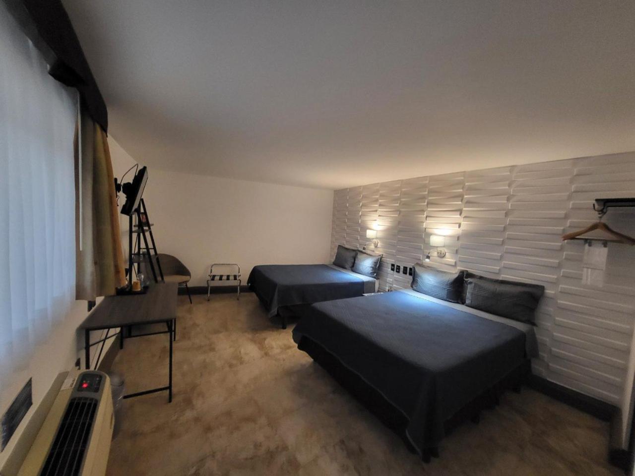 Queen Room with Two Queen Beds - Photo 1