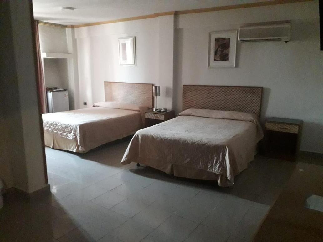 Deluxe Queen Room With Two Queen Beds photo 2