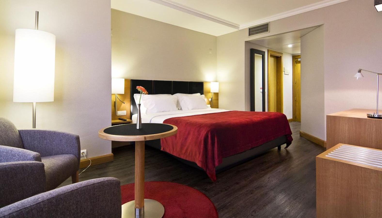 Experience comfort in a modern, stylish hotel room.