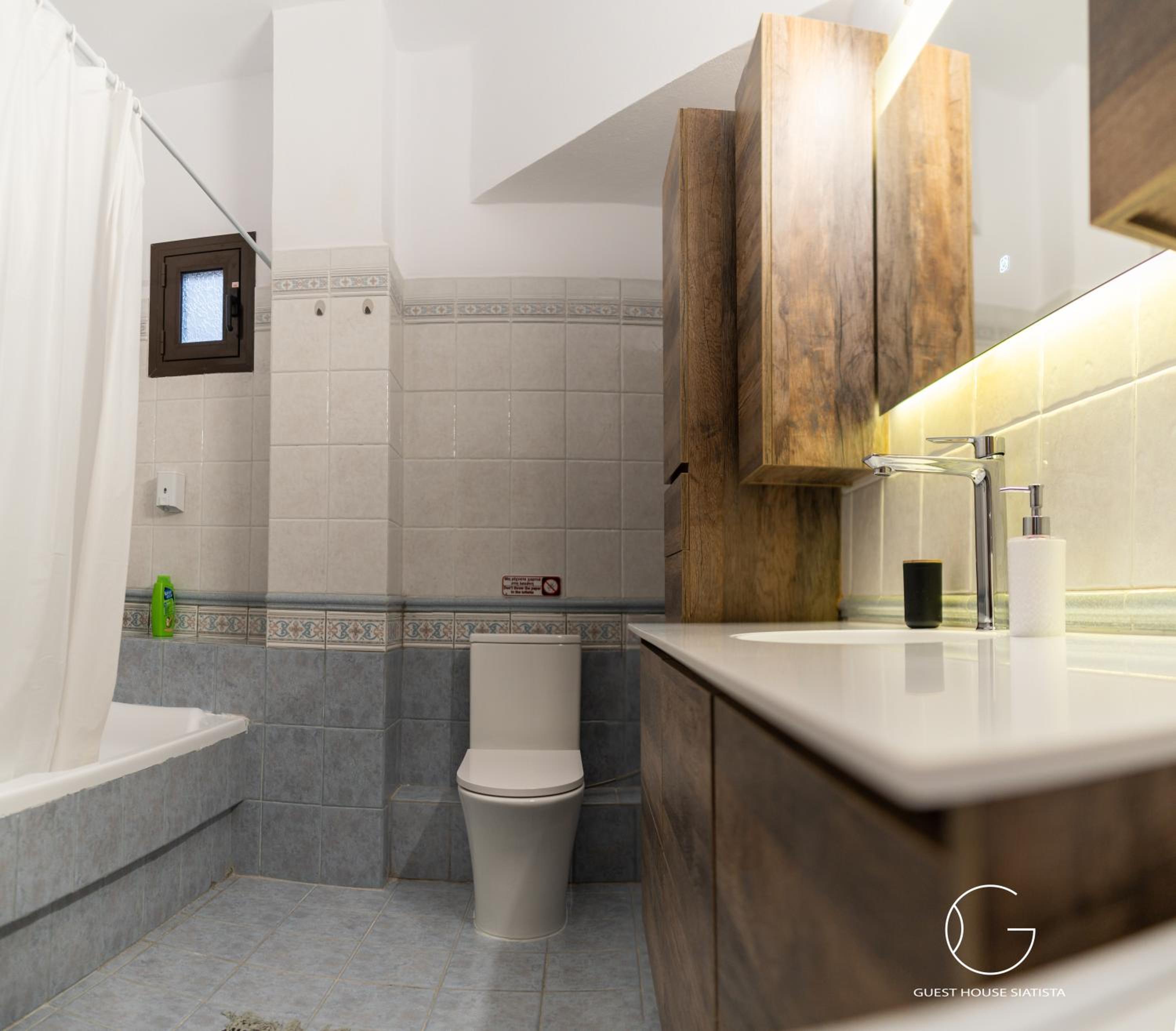Three-Bedroom House - Photo 24