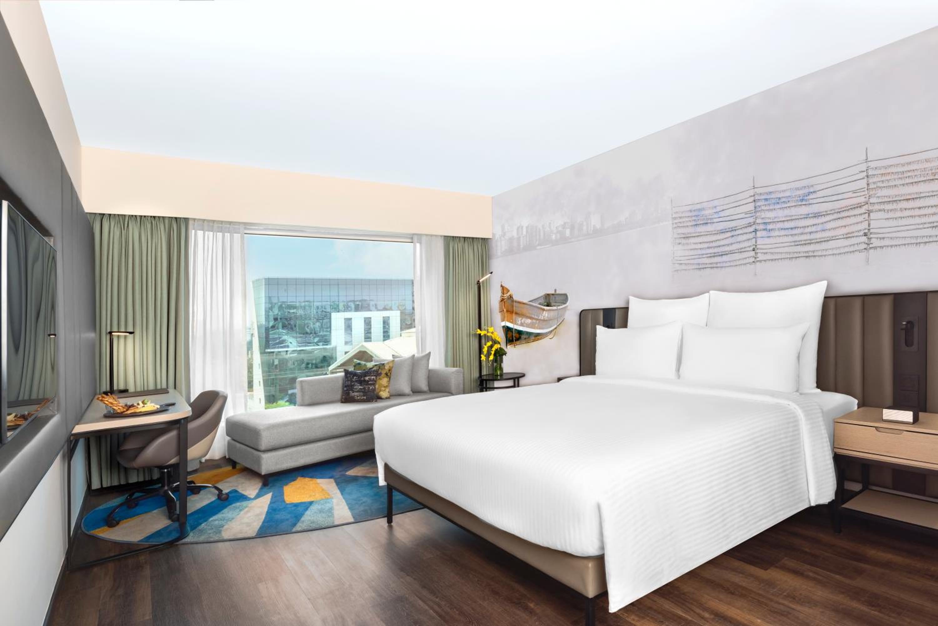 Deluxe King Room with 1+1 Happy Hours from 5pm to 7 pm on select beverages ,  20% Discount on Spa on select packages, Laundry, and Food & Soft Beverages