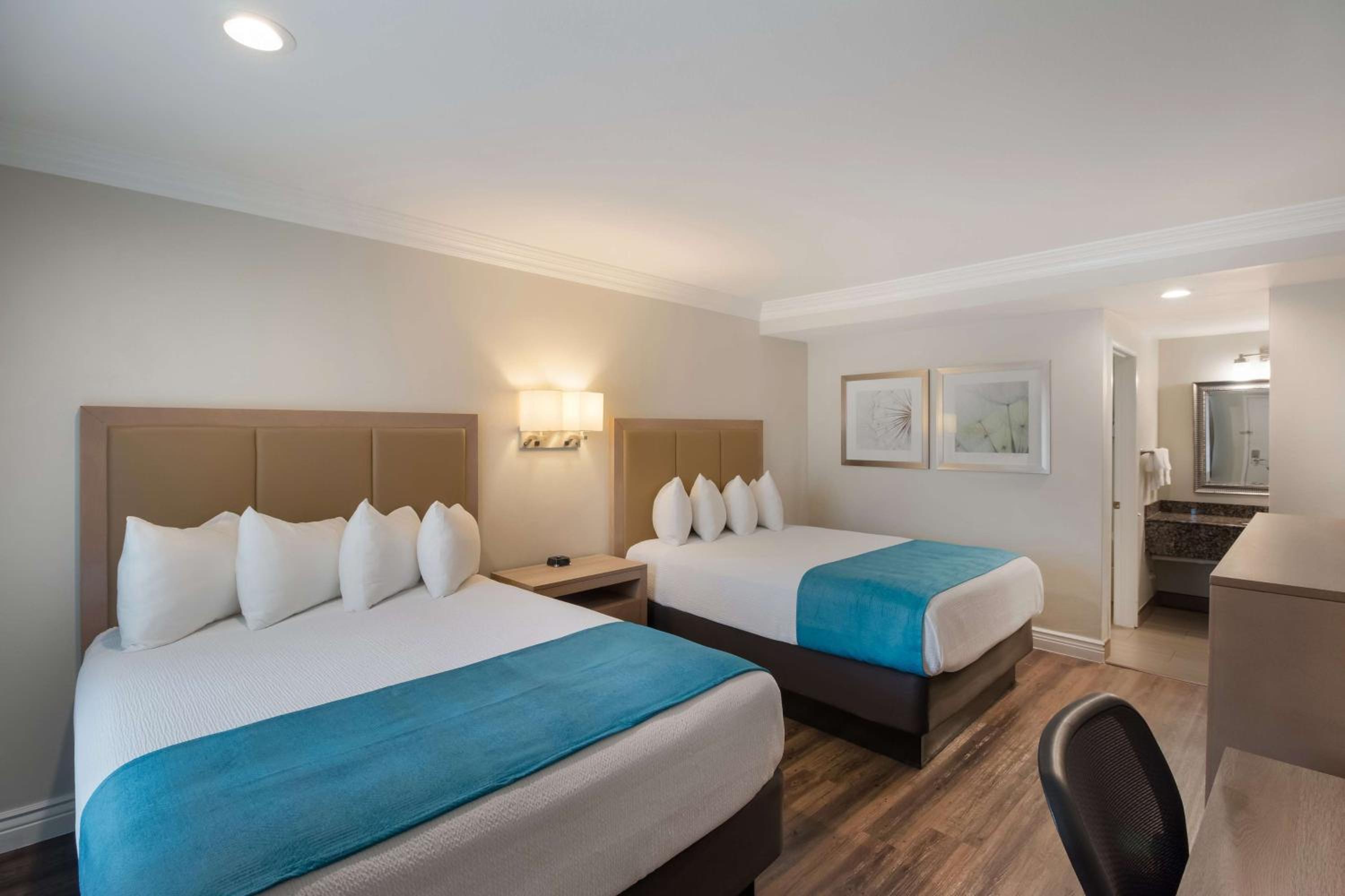 Two-Room Queen Suite with Two Queen Beds and Sofa Bed - Non-Smoking - Photo 1