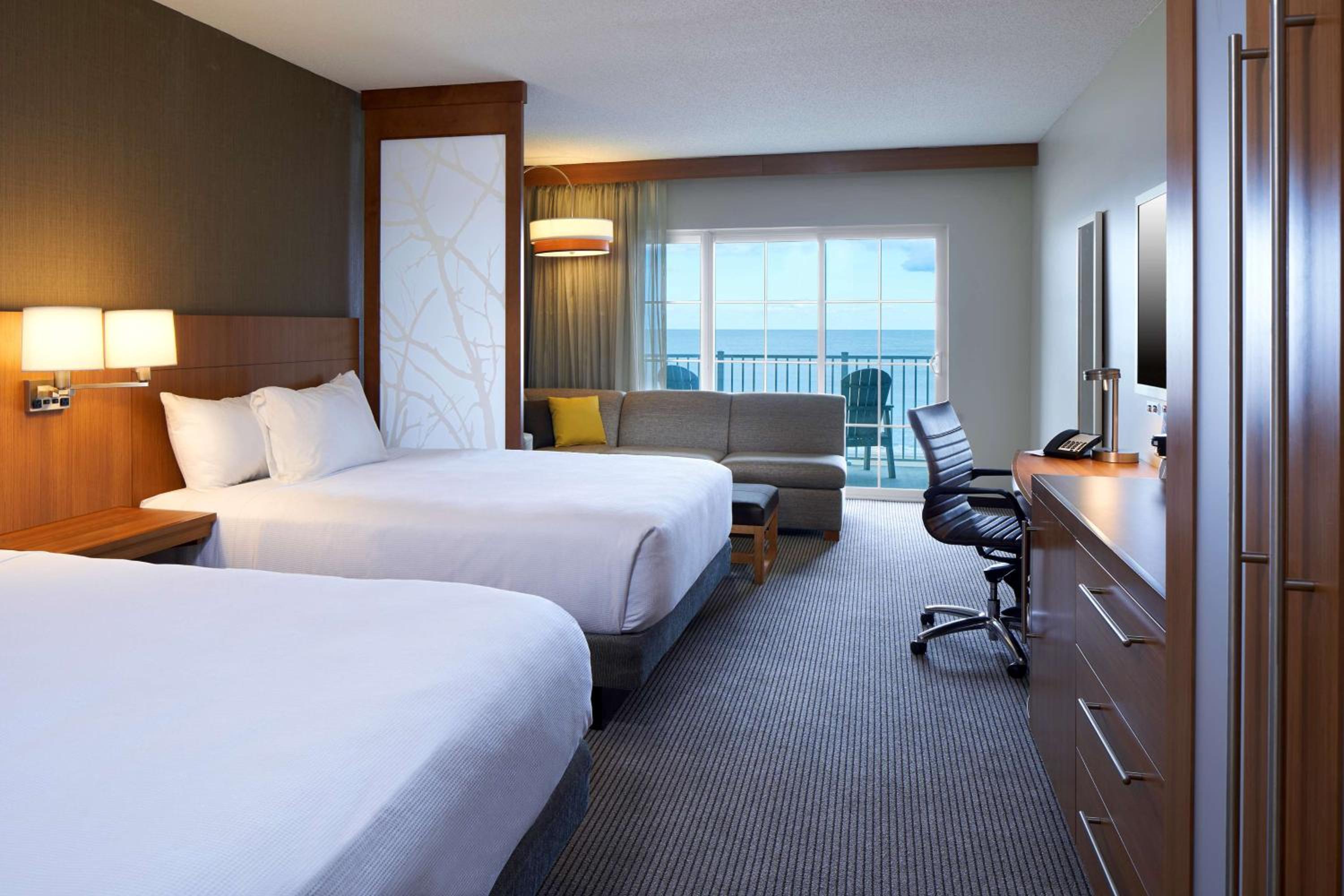 Queen Room with Two Queen Beds - Partial Ocean View photo 1