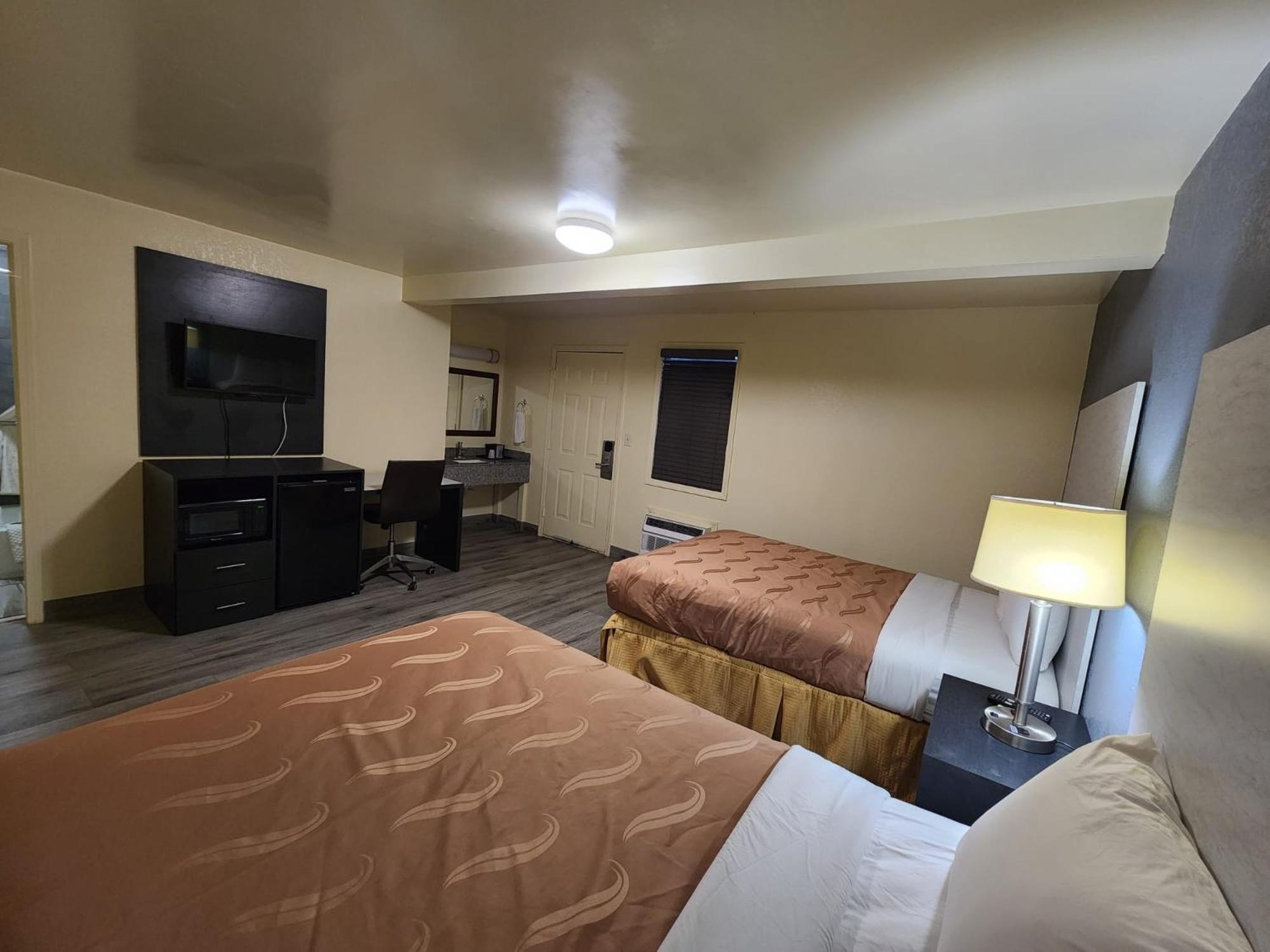 Standard Queen Room with Two Queen Beds - Photo 1