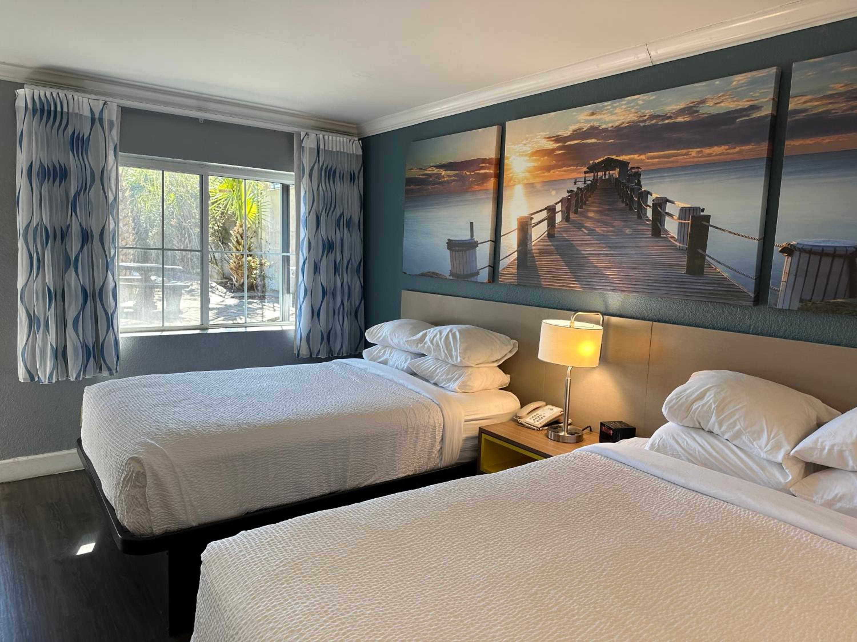 Room with One King and Two Double Beds with Bath Tub - Mobility Accessible/Non-Smoking photo 1