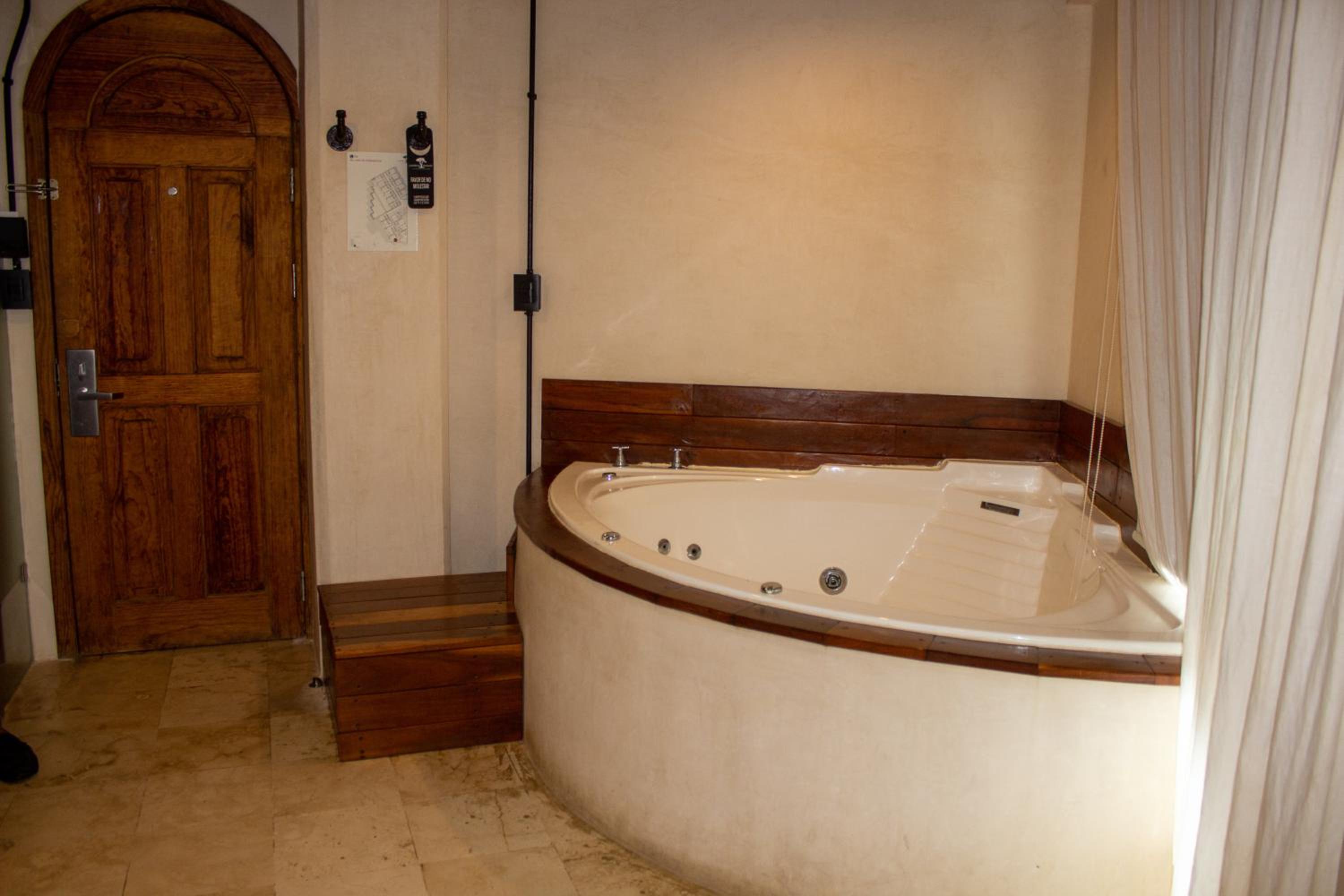 Master Suite with Jacuzzi, Balcony and City Views - Photo 10
