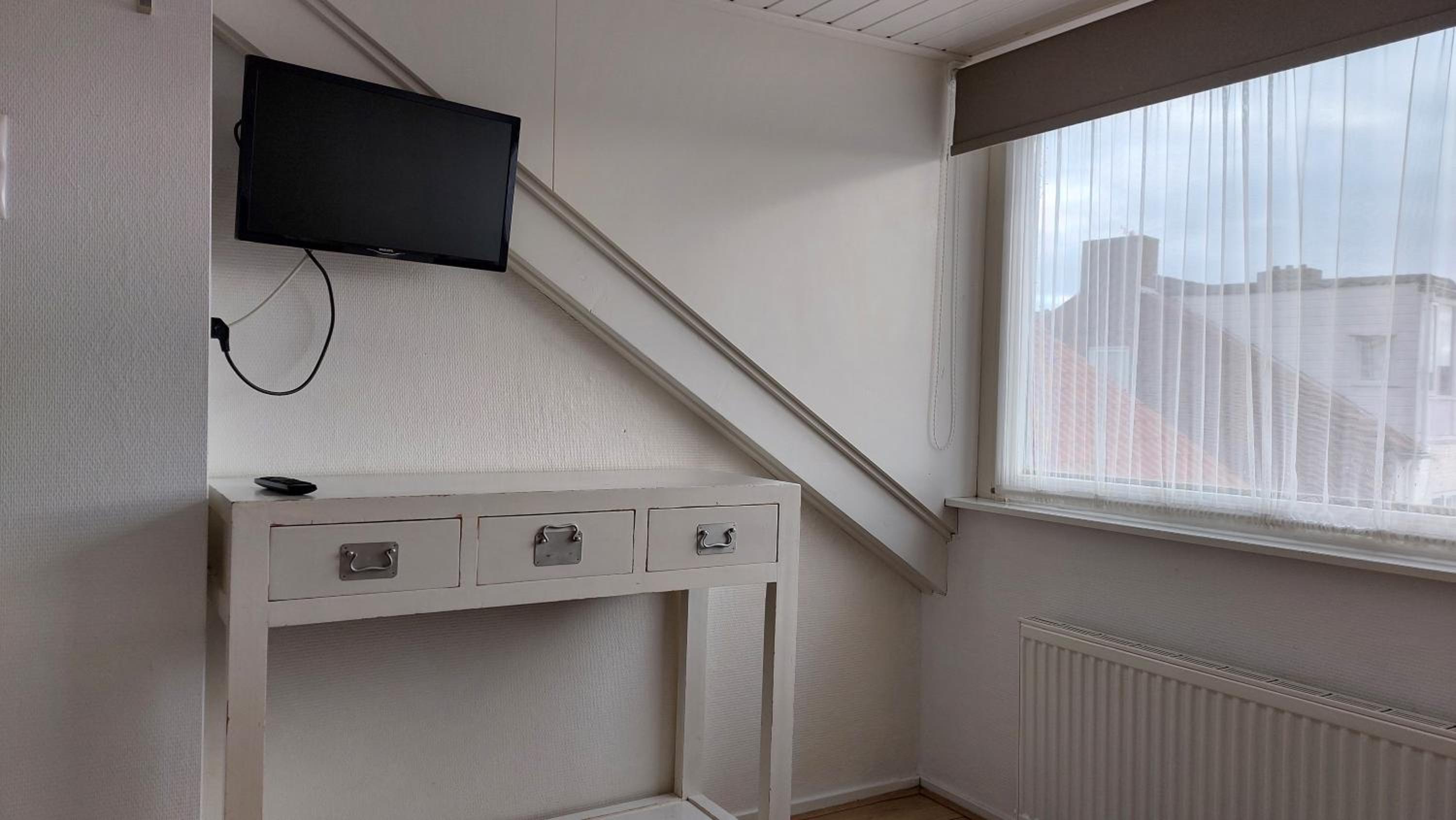 Three-Bedroom Apartment - Photo 10