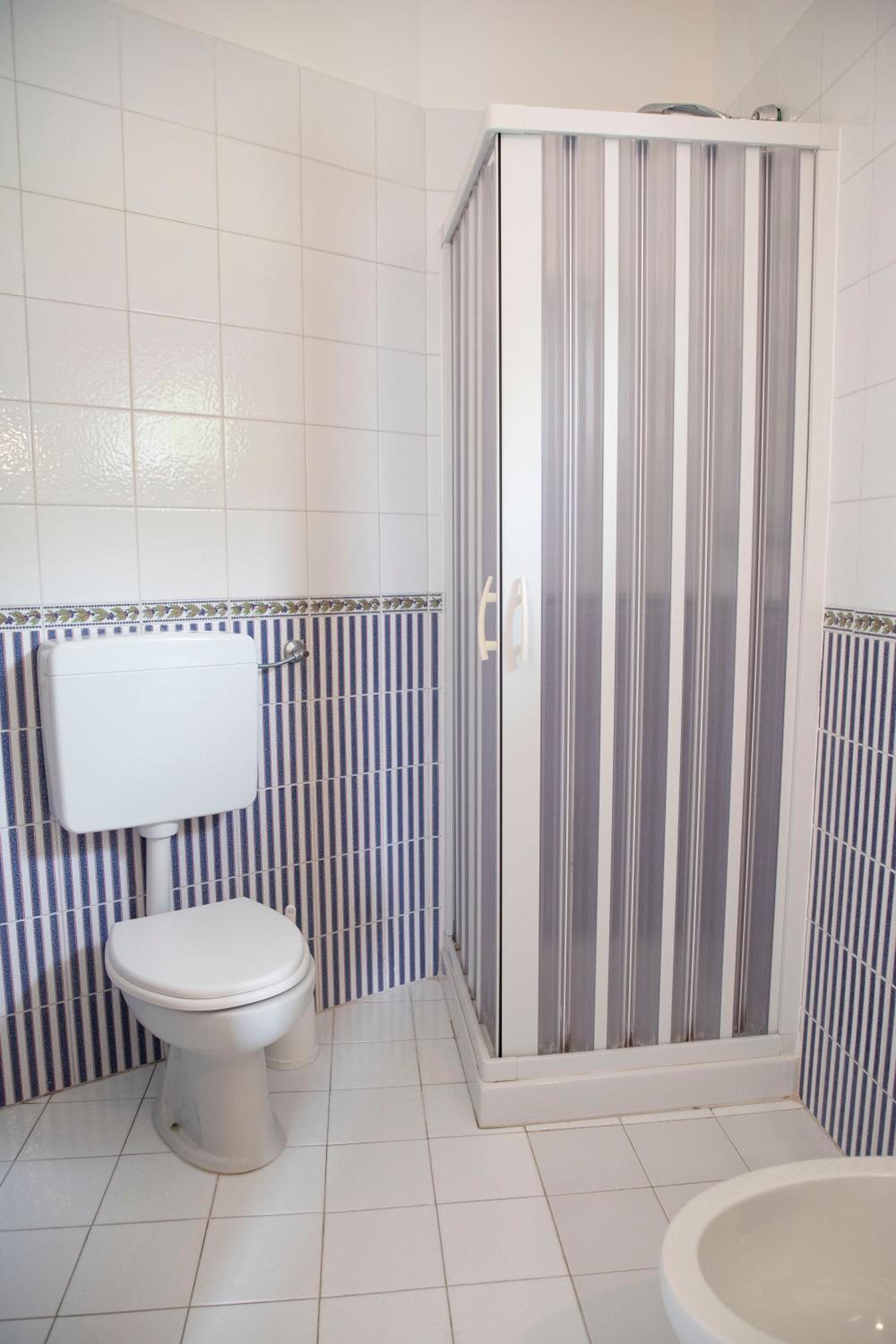 Relax in a clean and modern bathroom oasis.