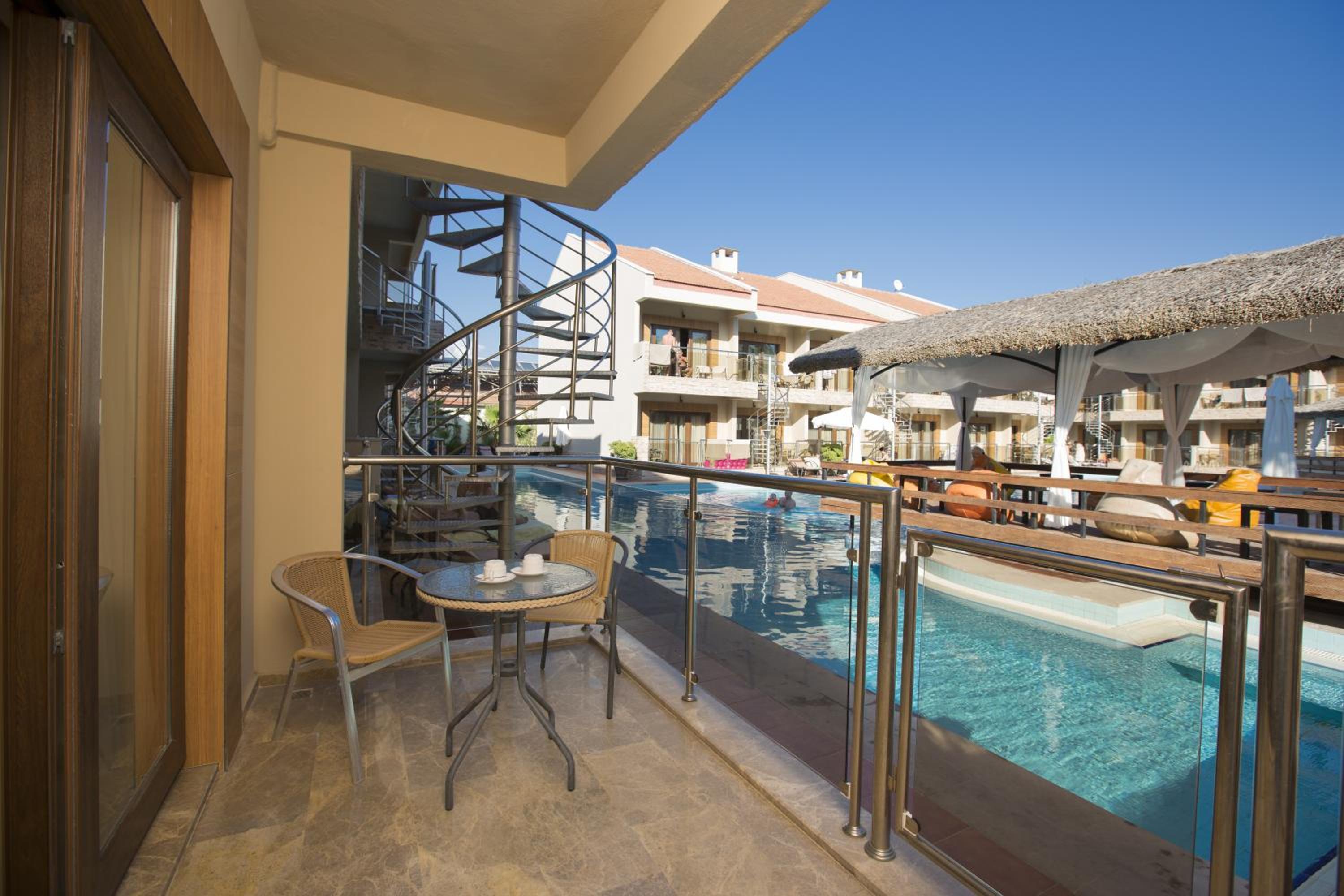 Relax on your private balcony overlooking the pool!