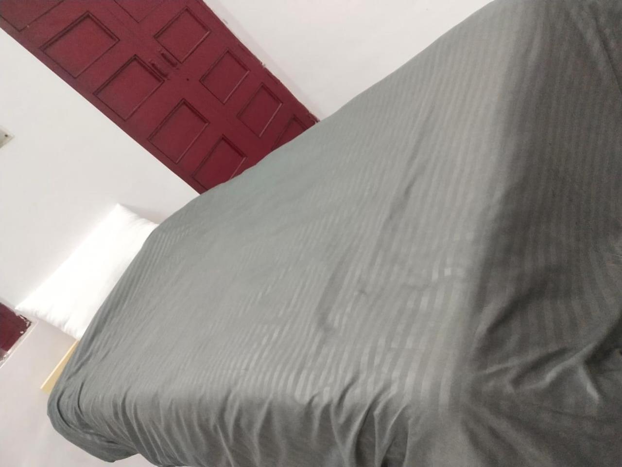 Single Bed in Dormitory Room
