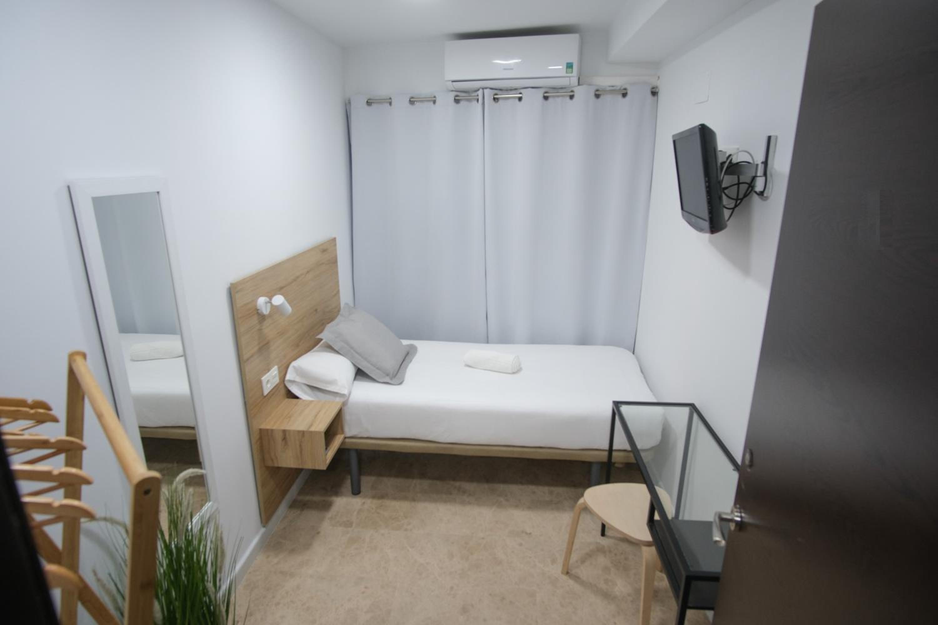 Habitación individual con baño compartido