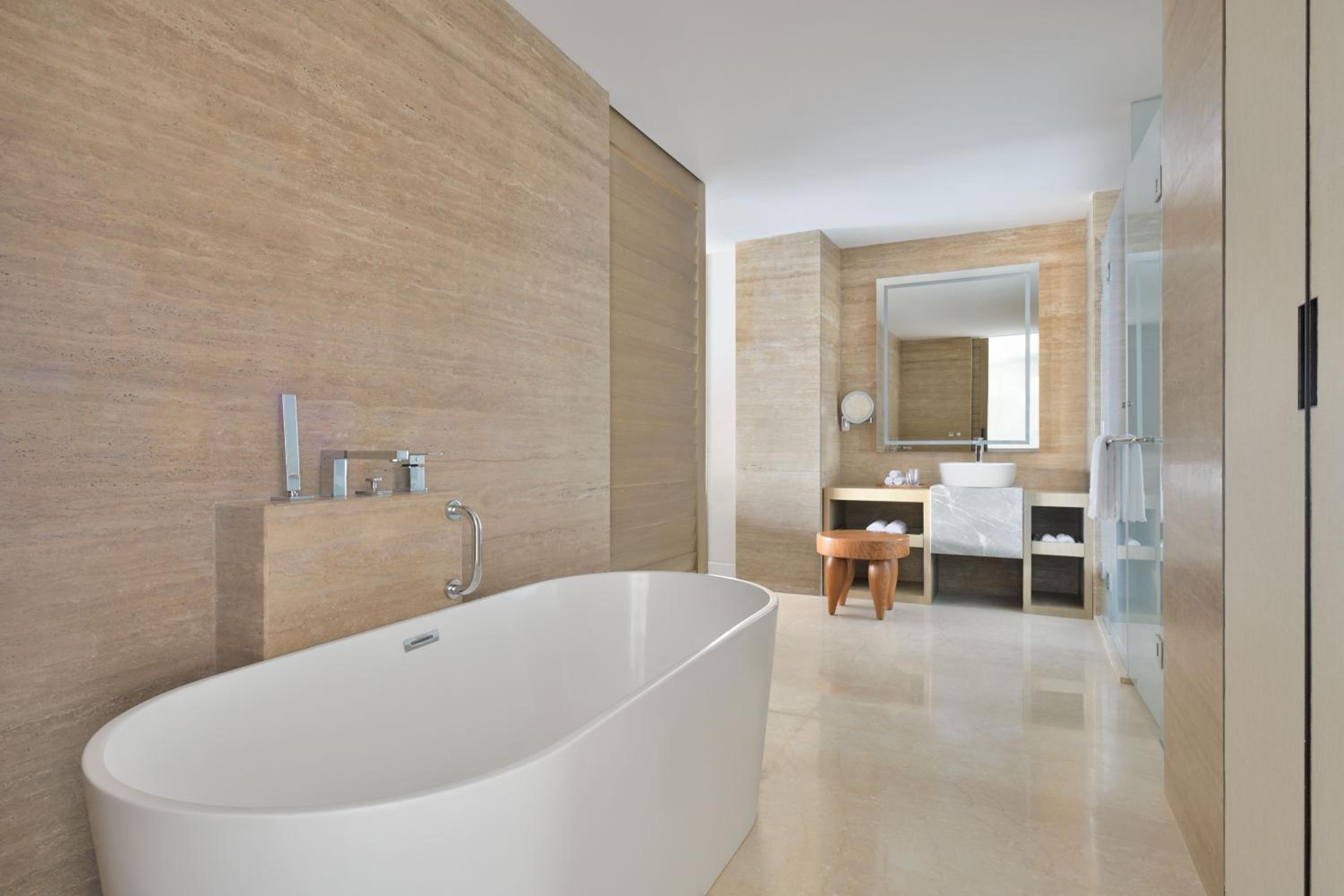 King Suite with Garden and Plunge Pool - INR 2,500 wellness credit per day (non-cumulative), redeemable against Spa therapy or at Hakuna Matata (the gaming zone)