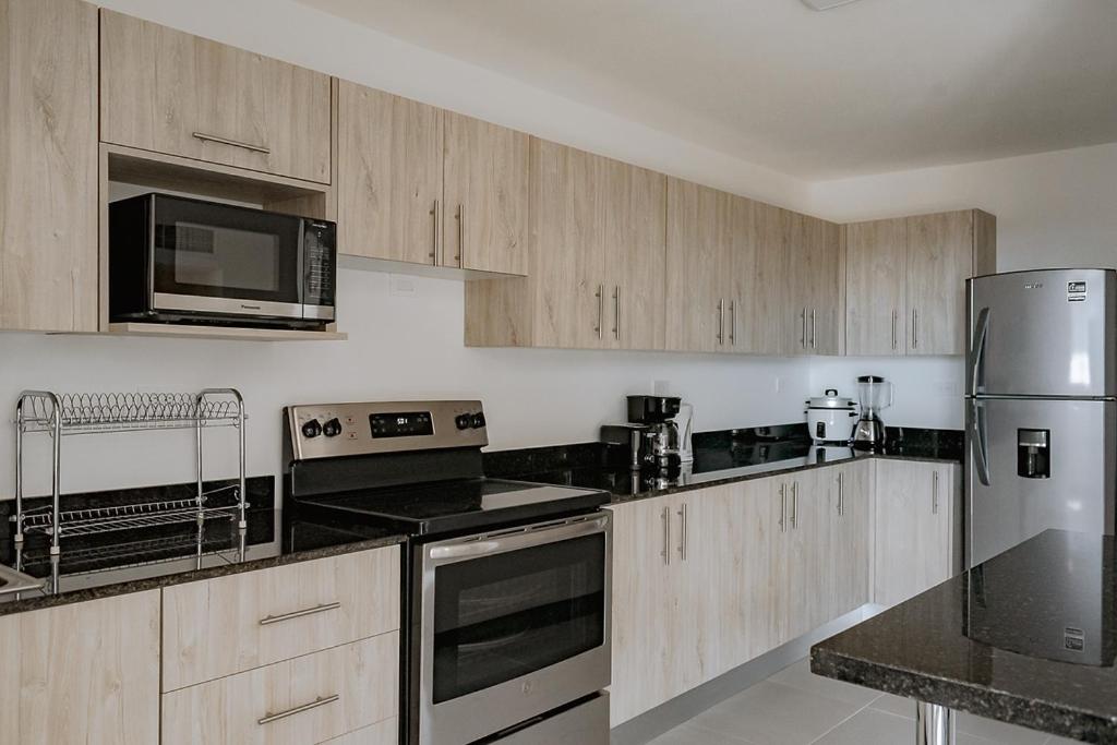 Three-Bedroom Apartment - Photo 28