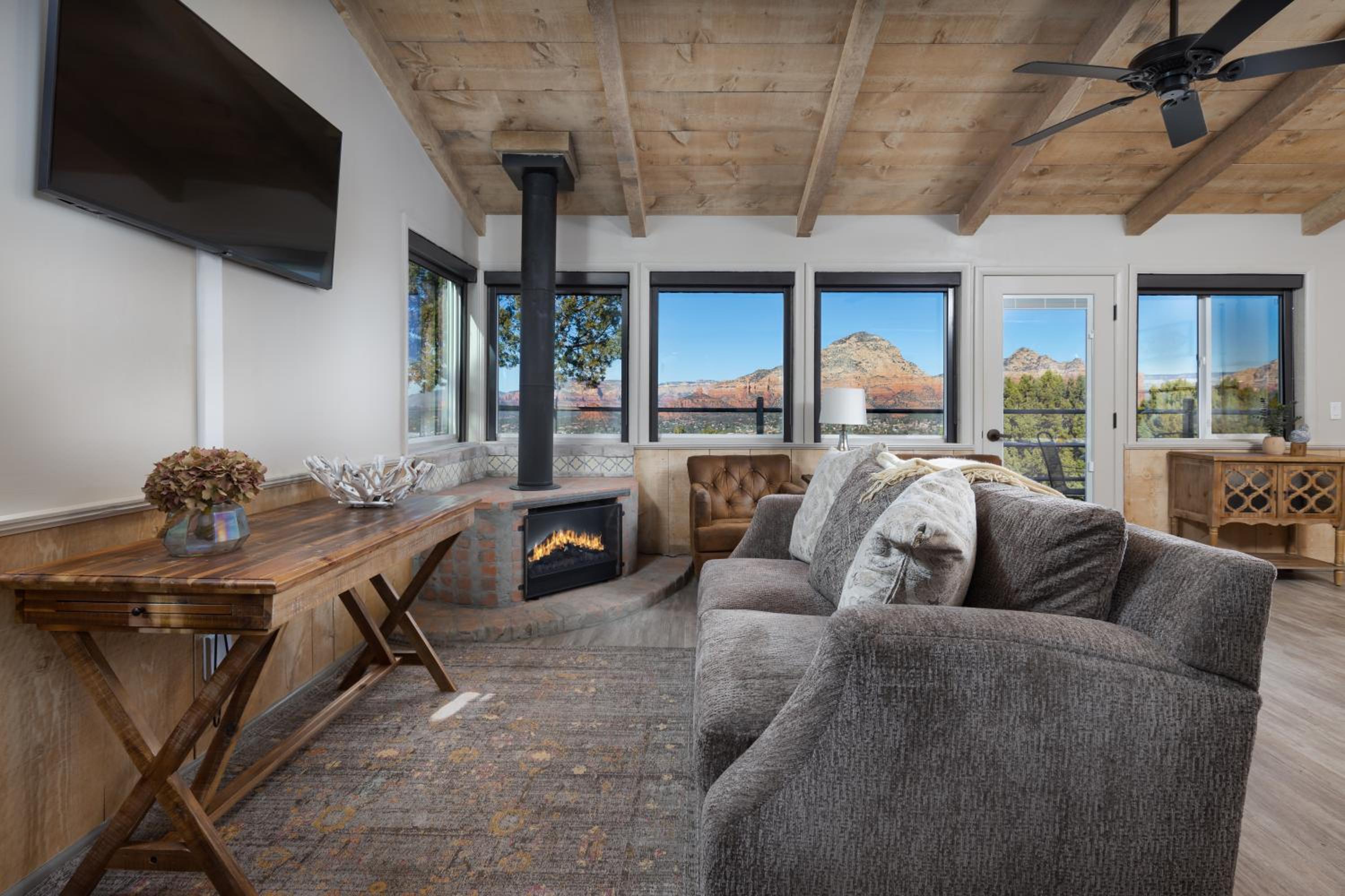 Modern living room with fireplace and mountain views