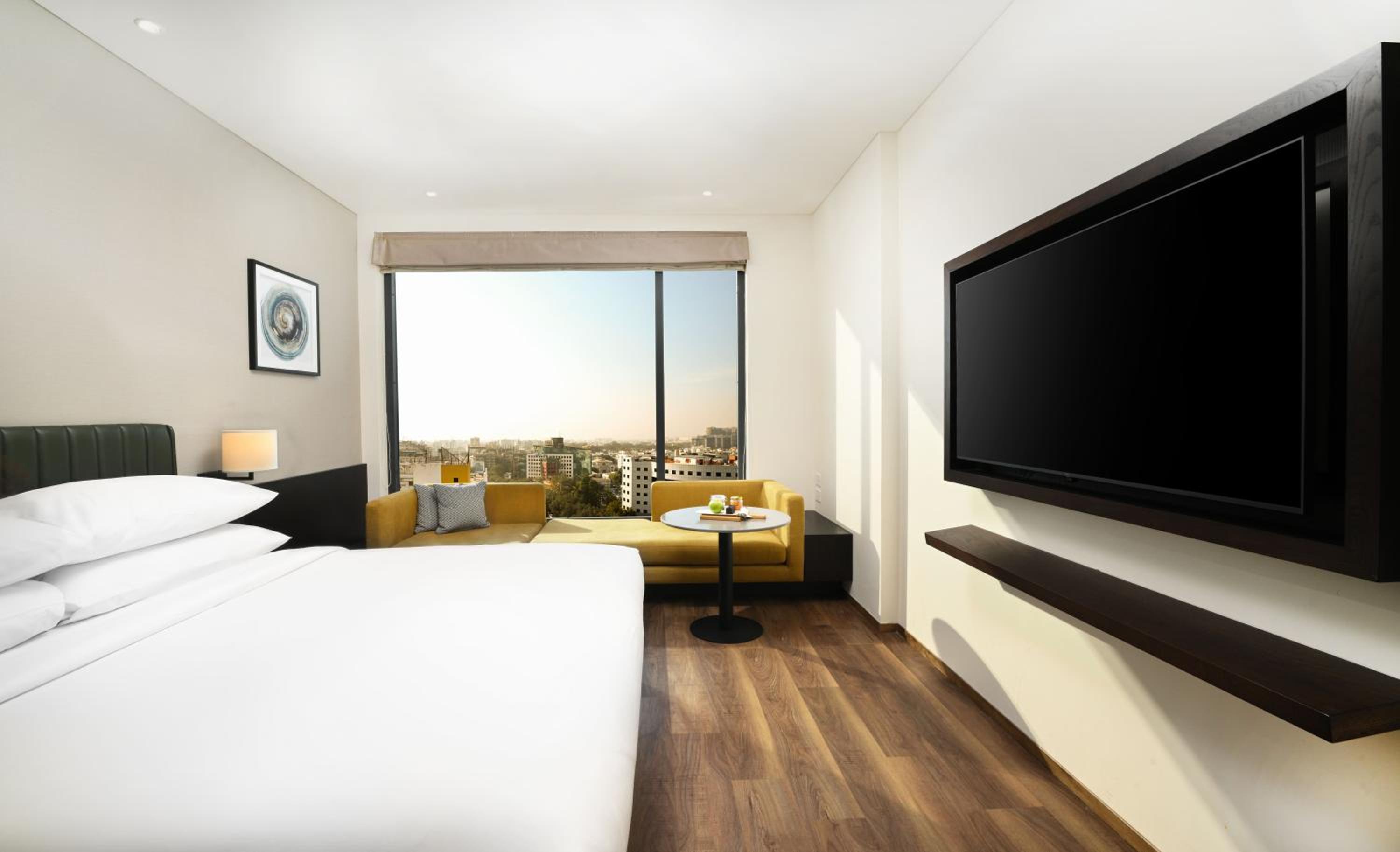 Premium King Room On Higher Floors With Welcome Amenities (Early Check in &Late Check out-subject to availability,10% off on Laundry )