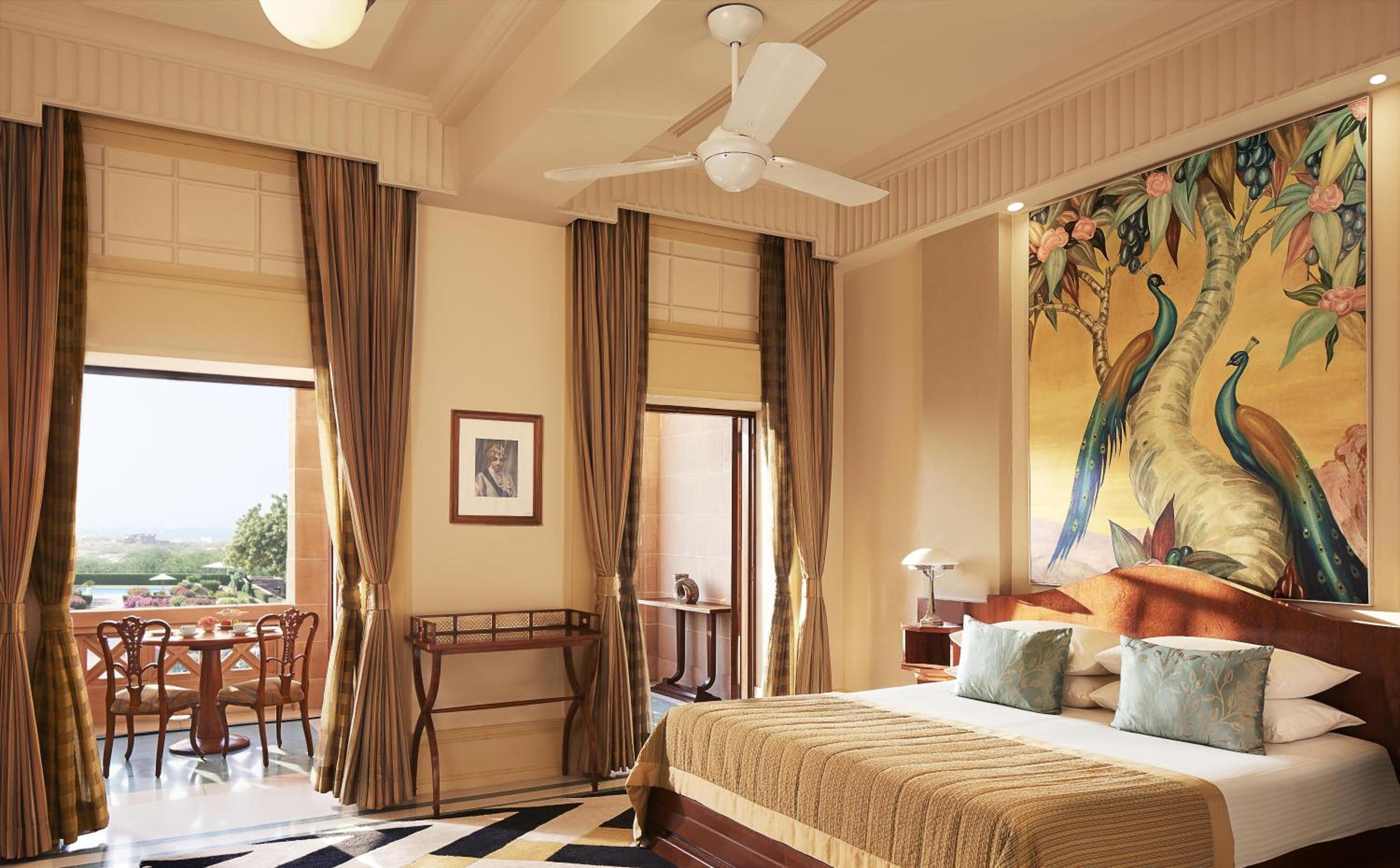 hotel room with a large painting hanging on the wall