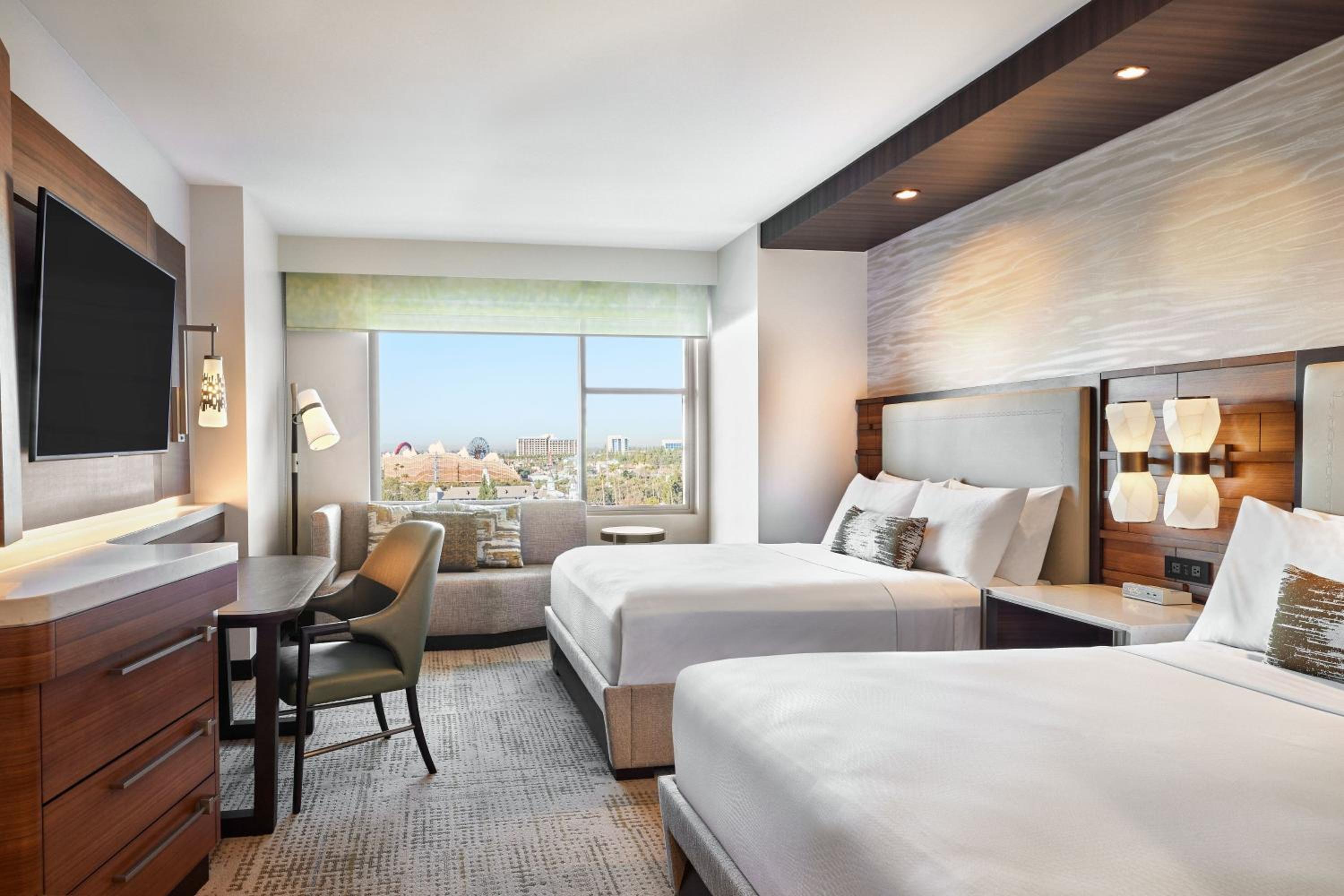 Deluxe Queen Room with Two Queen Beds and Premium Theme Park View - Photo 1