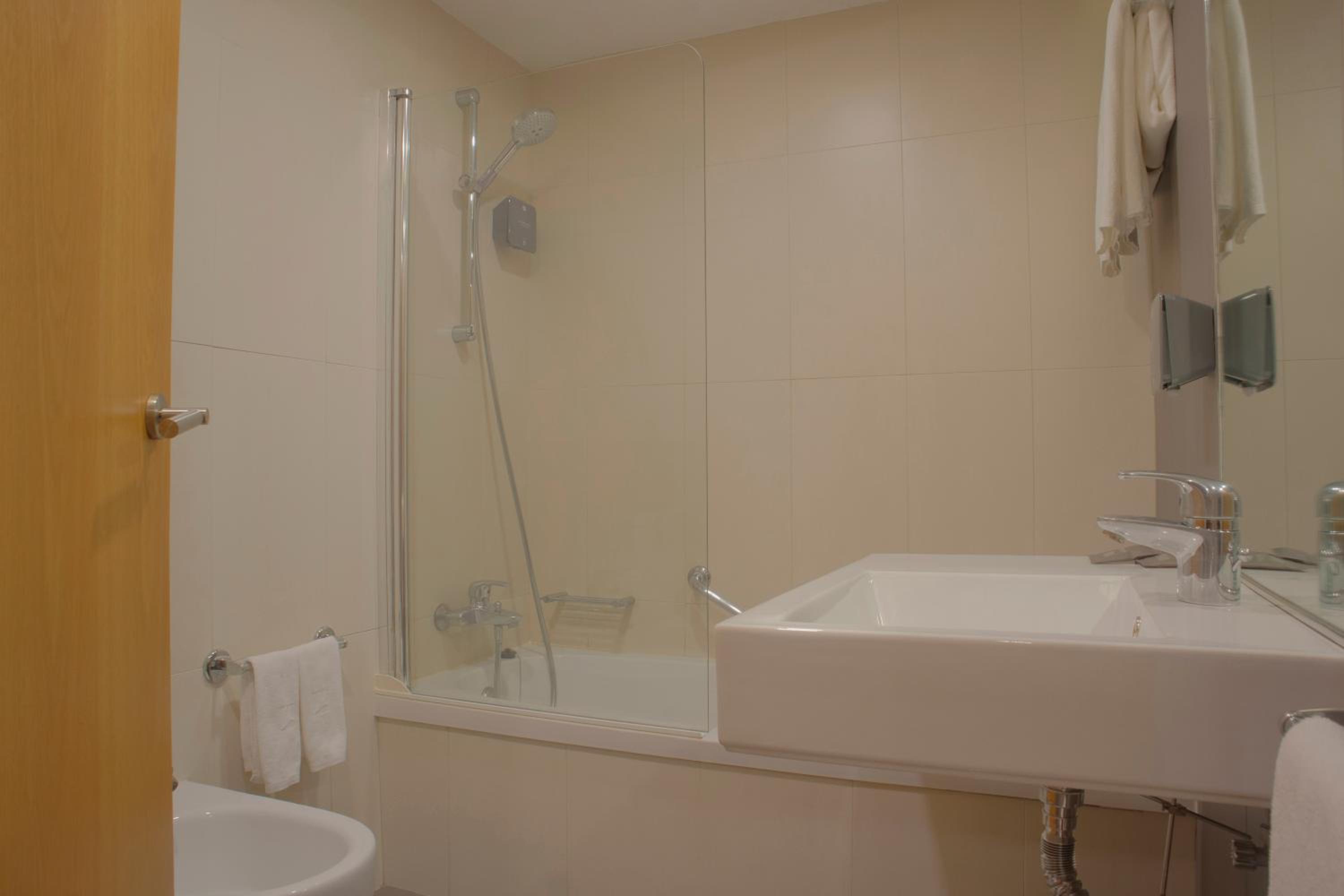 Relax in a stylish and modern bathroom retreat.