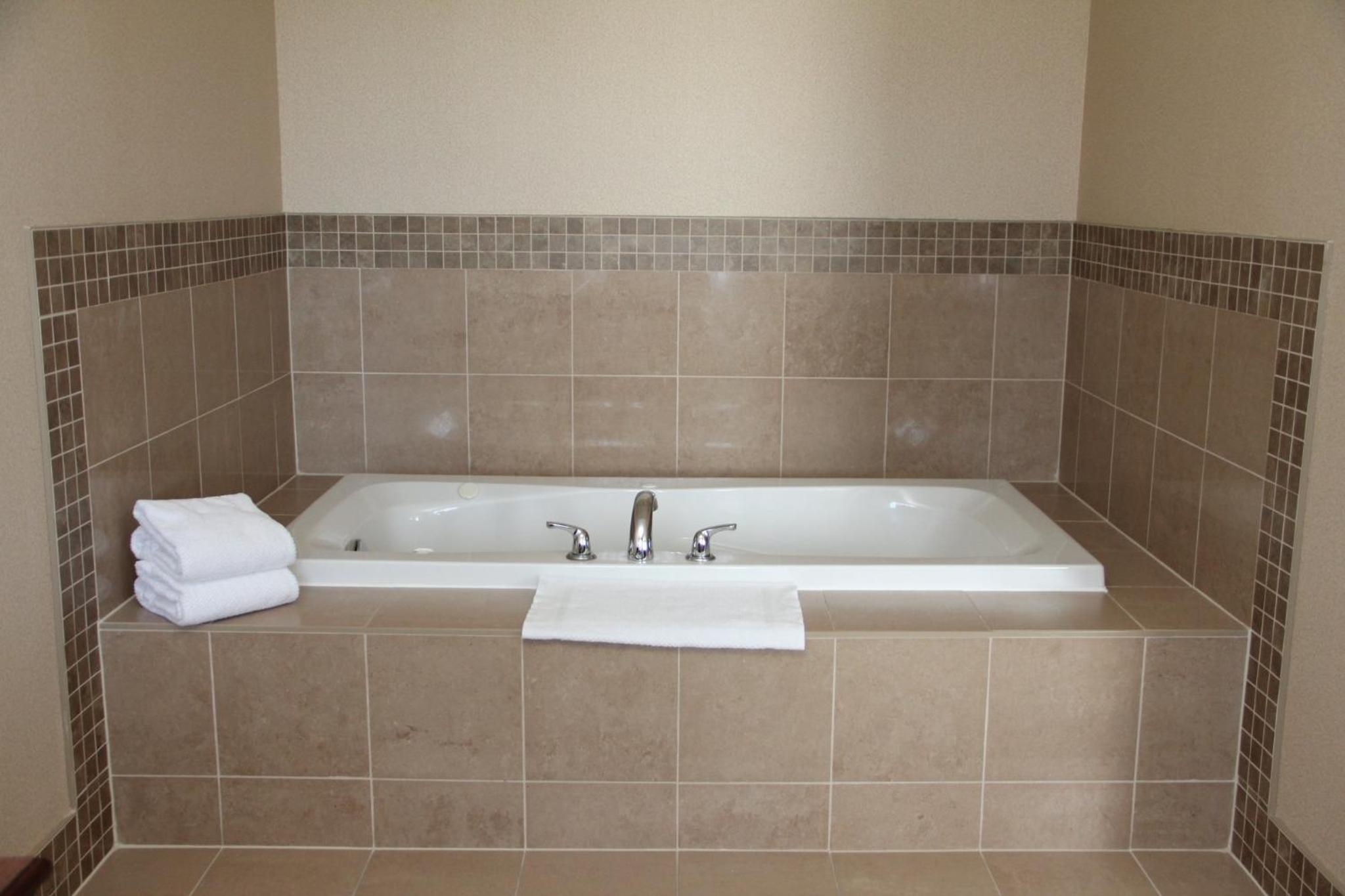 jacuzzi tub in the corner of a bathroom