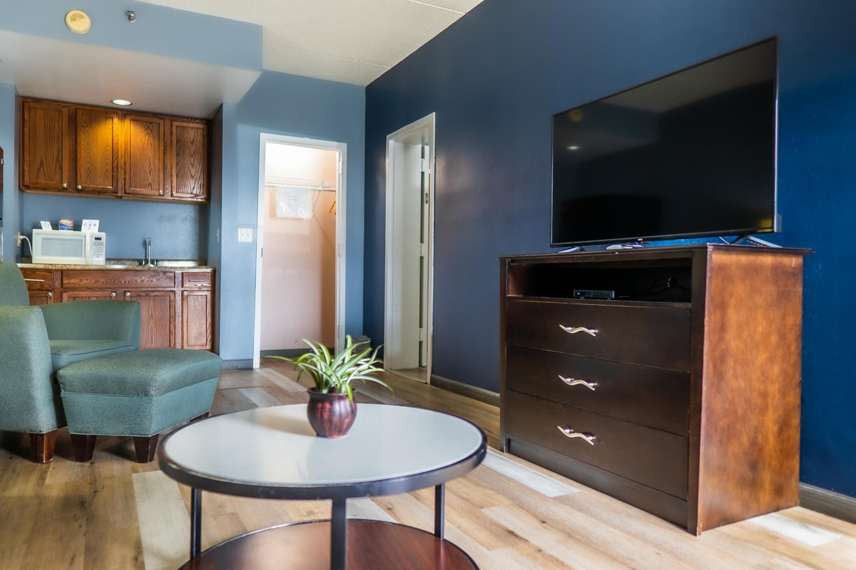 living room with a flat screen tv and blue walls