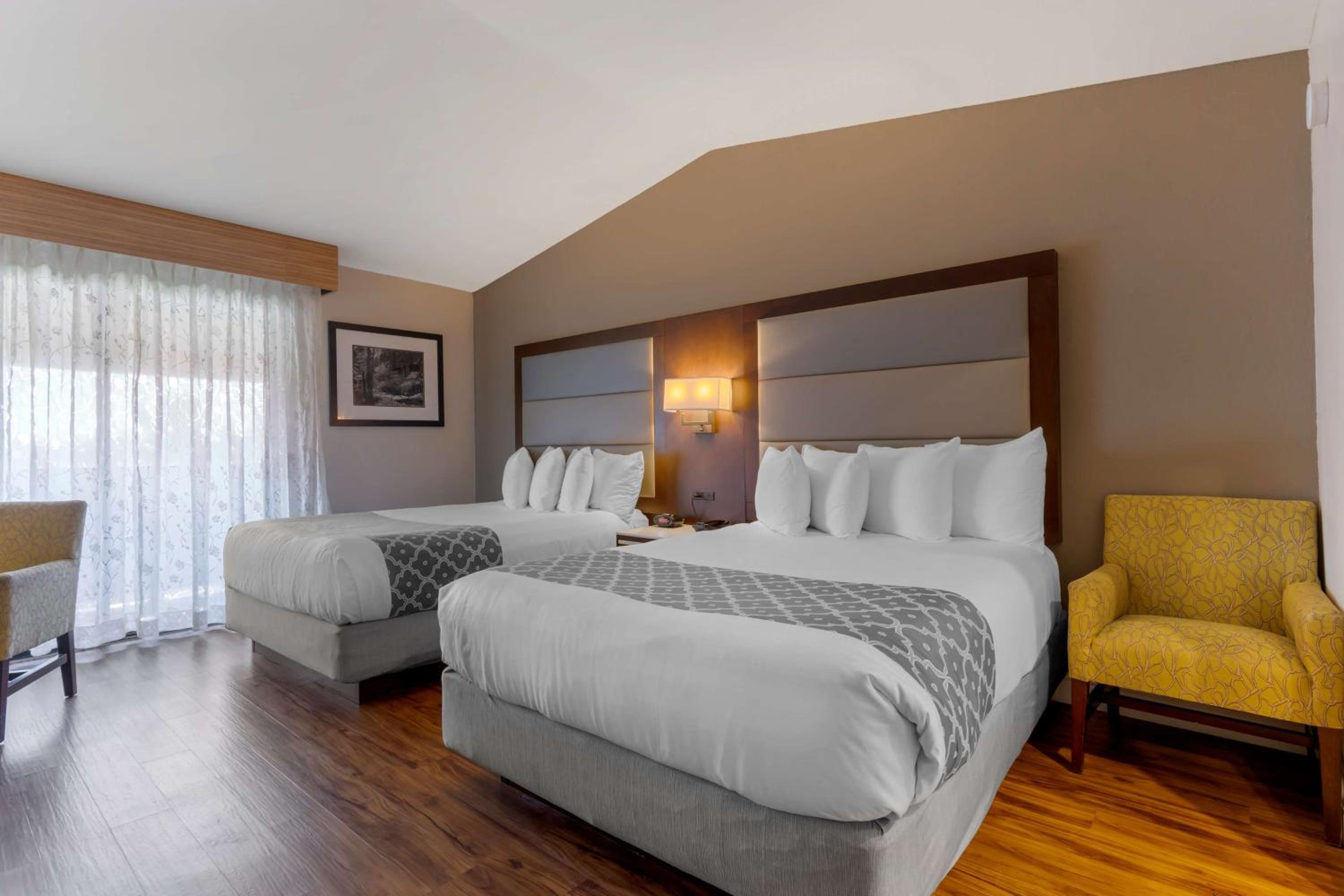 Queen Room with Two Queen Beds and Fireplace - Photo 1
