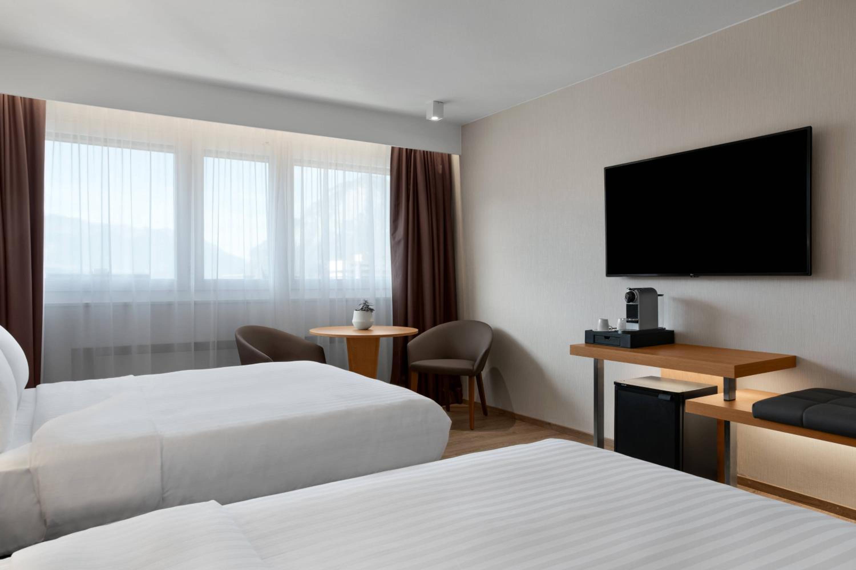 Standard Guest Room with Two Double Beds and Mountain View - Photo 1