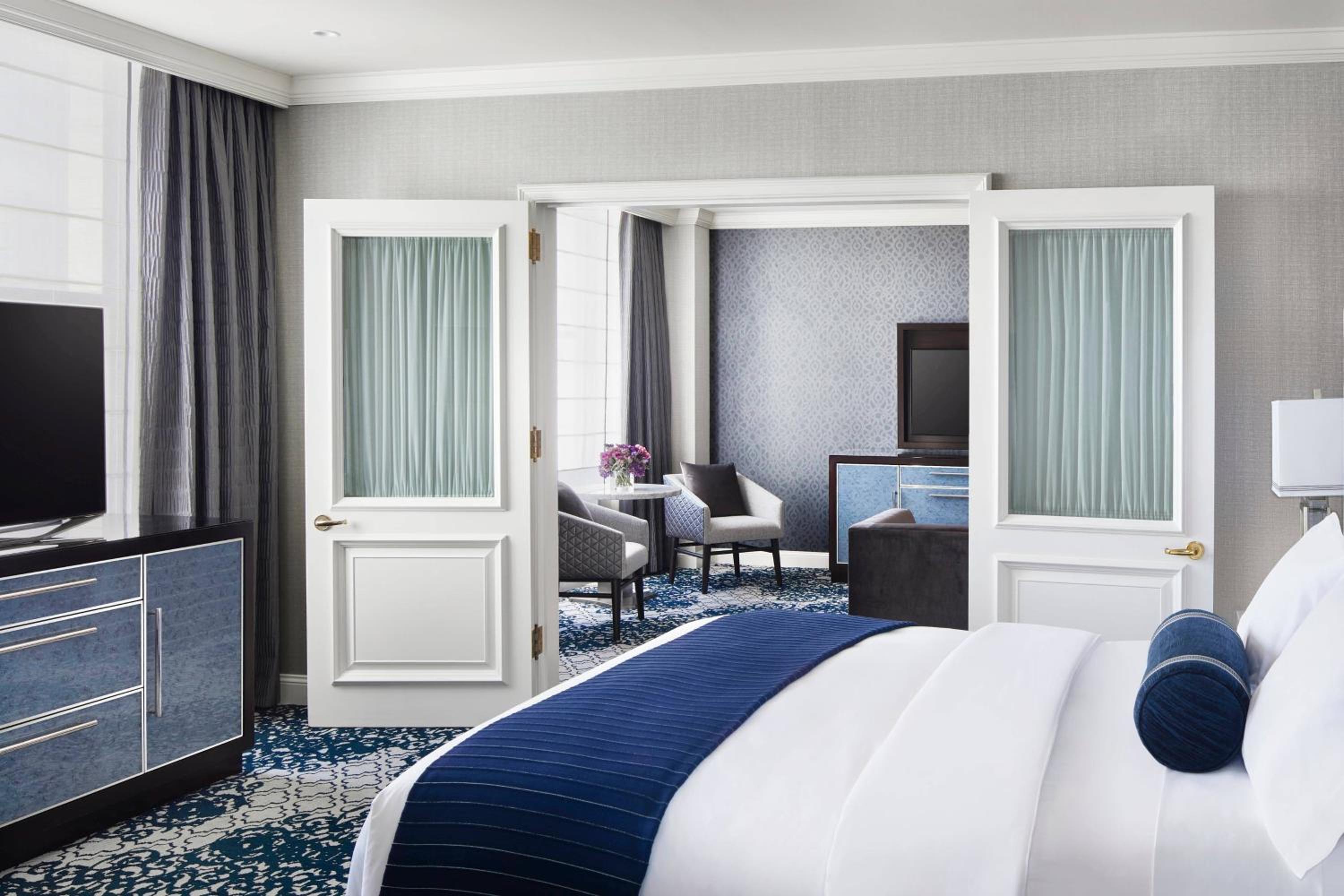 hotel room with a large bed and a flat screen tv