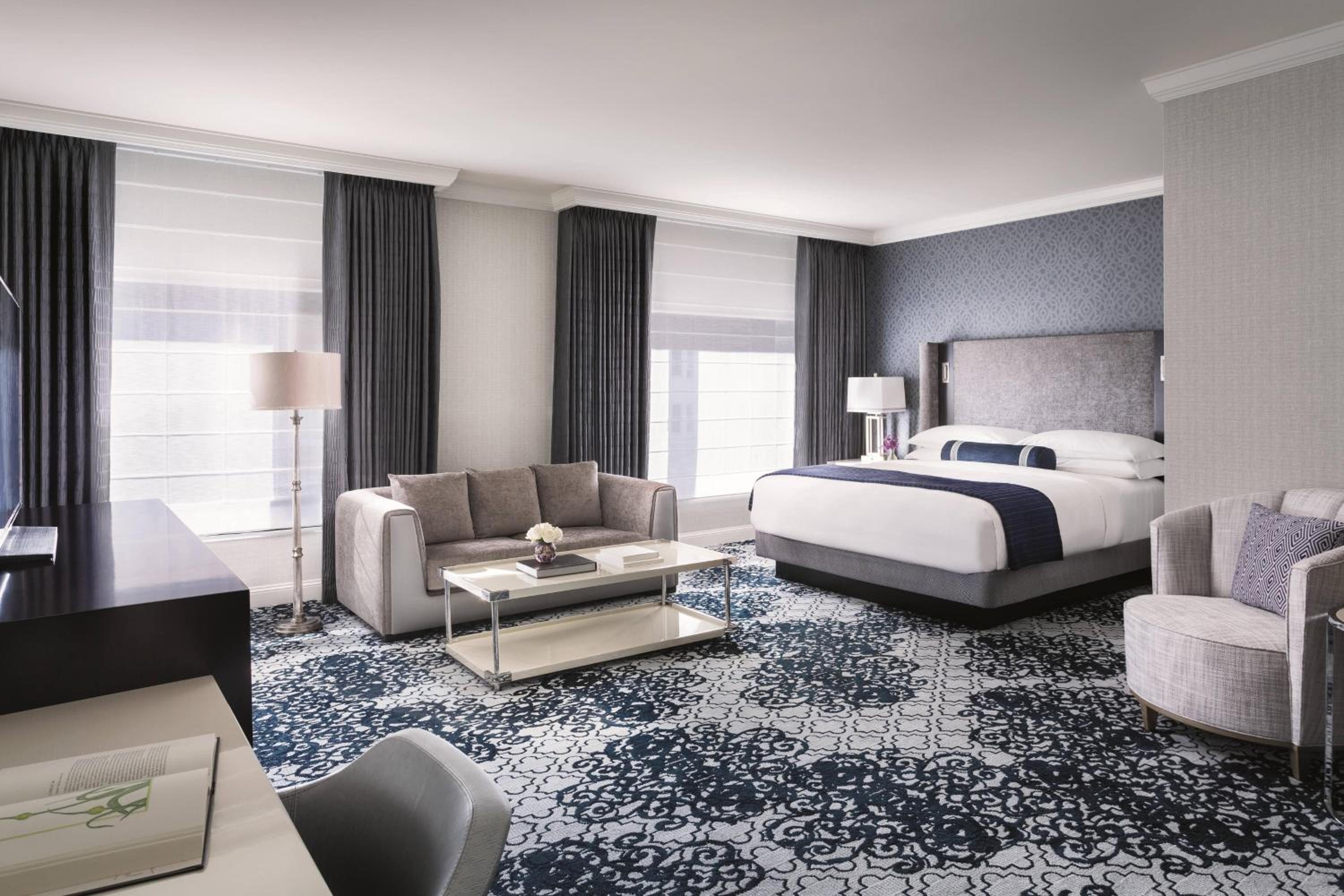 hotel room with a king size bed and a sofa