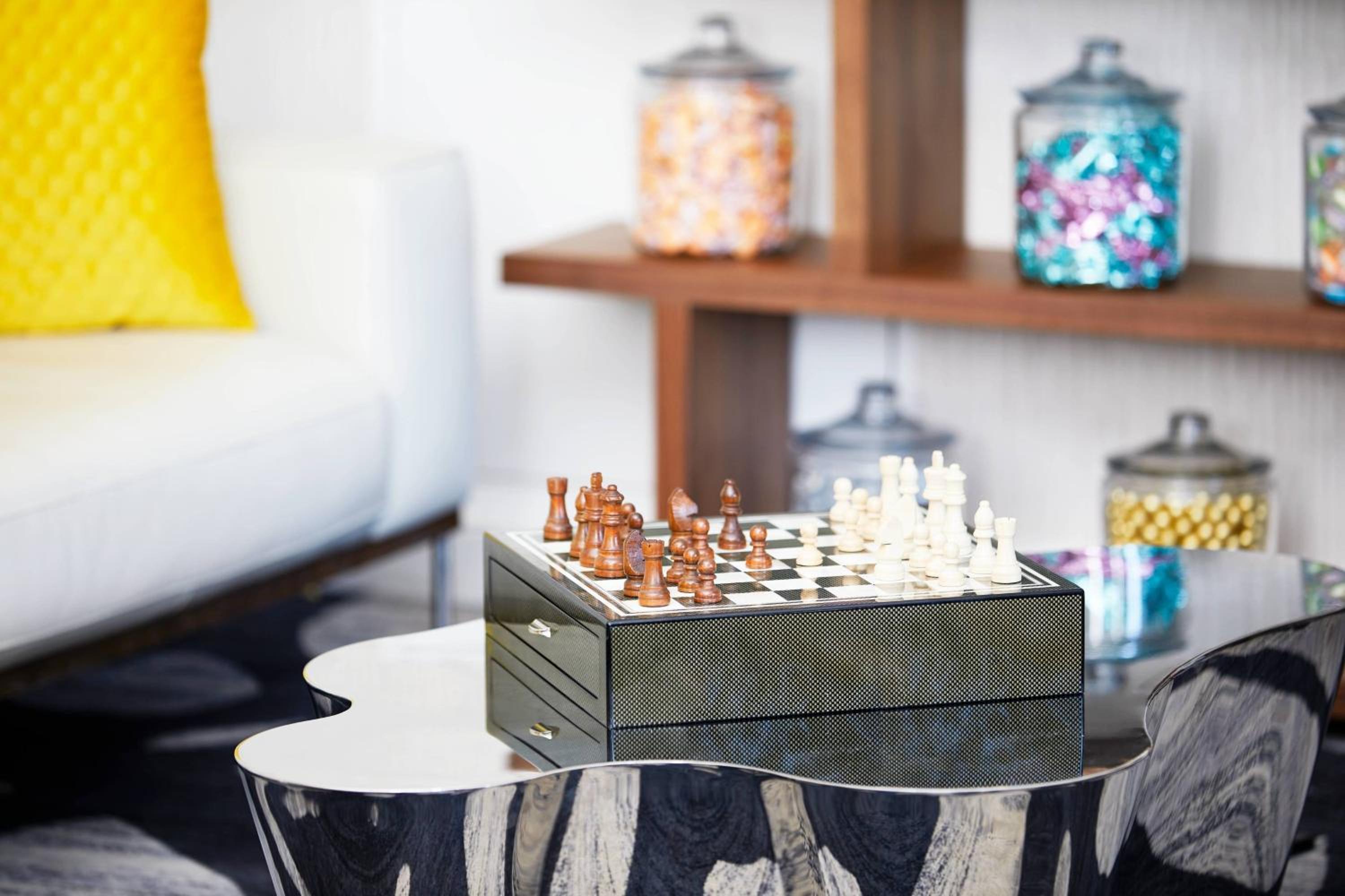 coffee table with a chess board on top of it