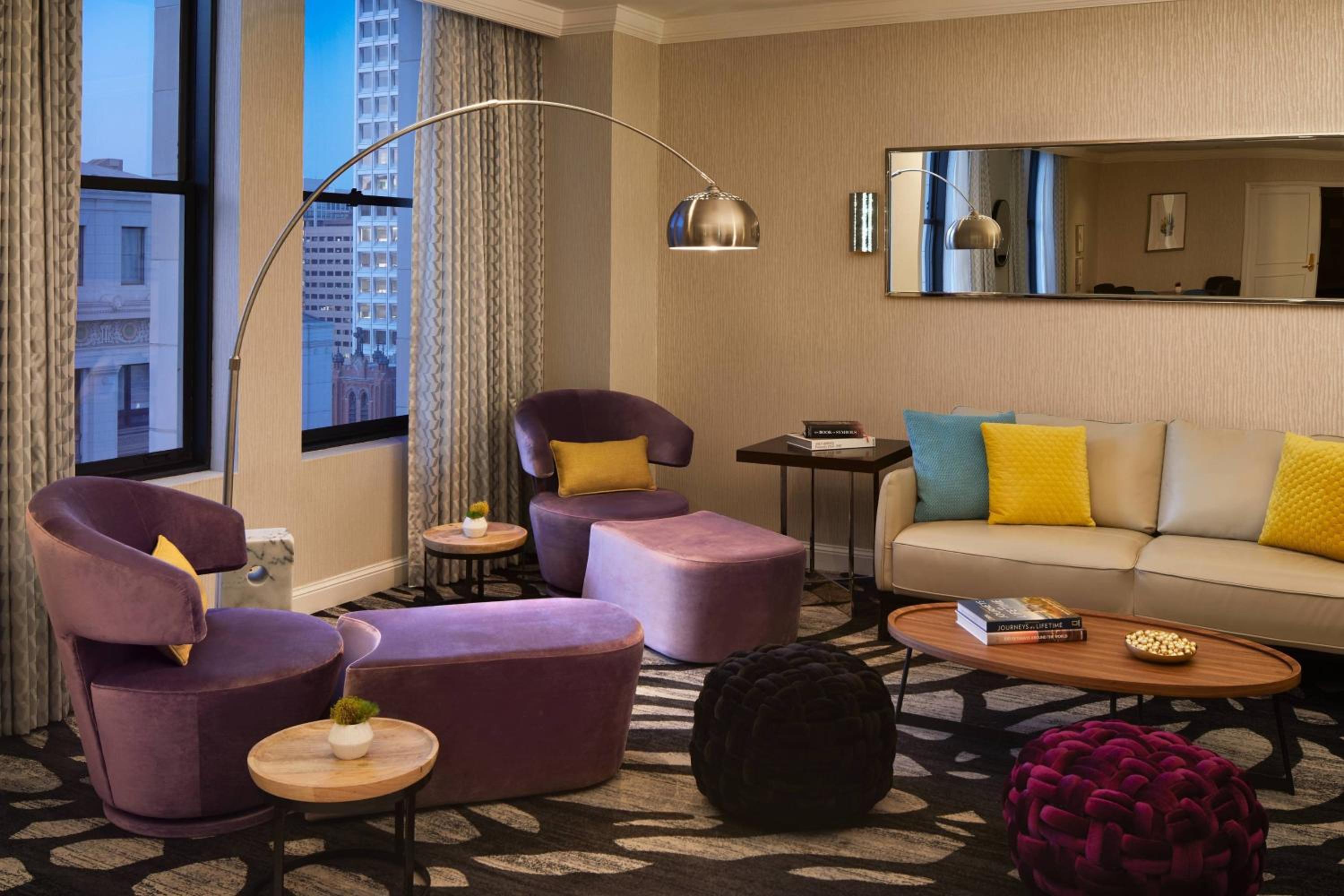 photo of a living room with purple and yellow furniture