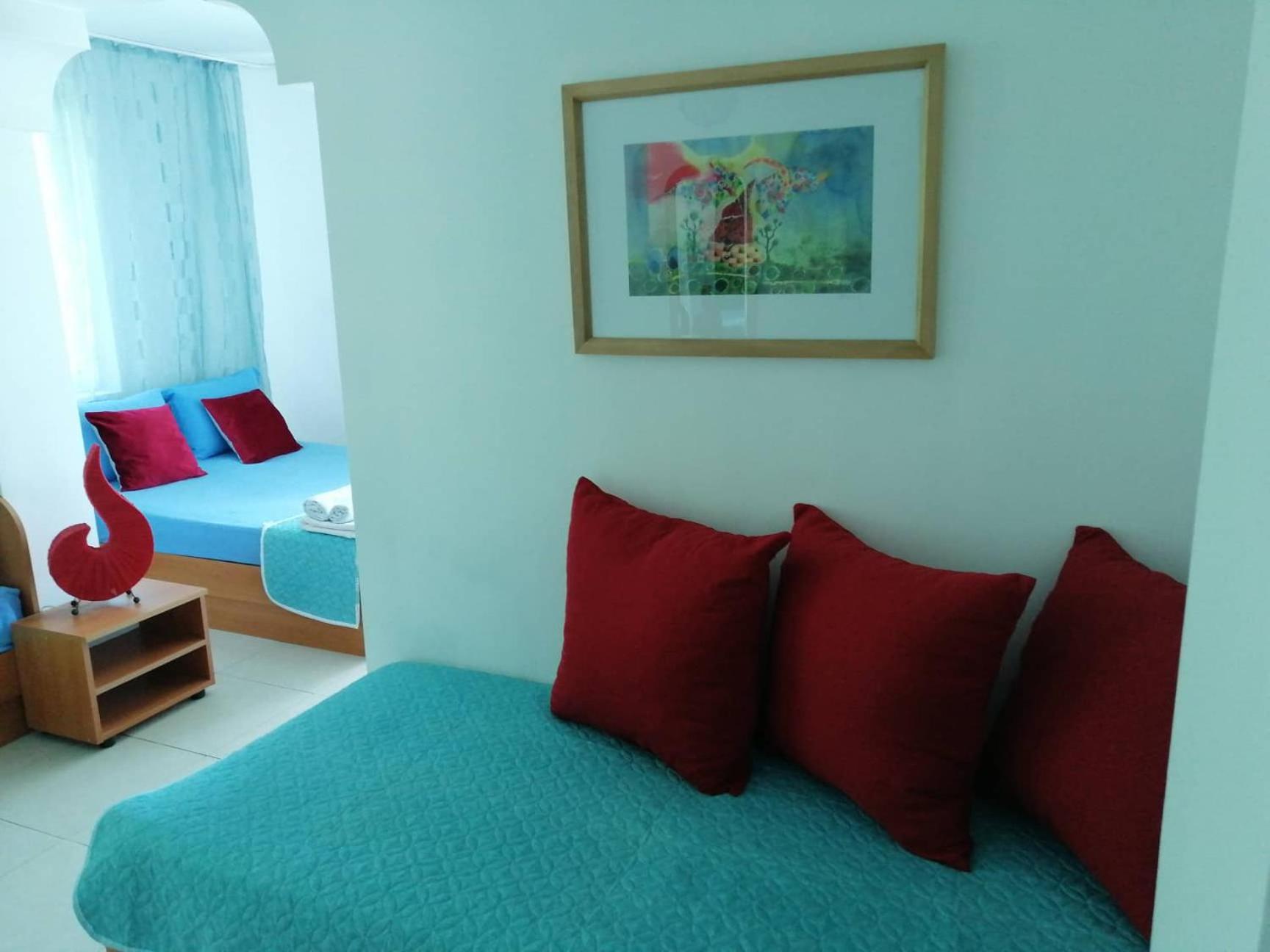 Quadruple Room with Balcony - Photo 1