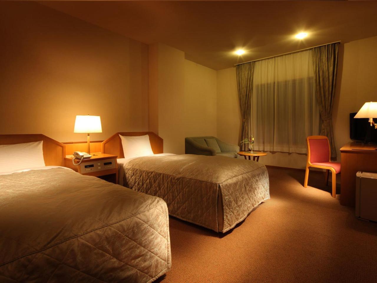 Standard Twin Room - Photo 4