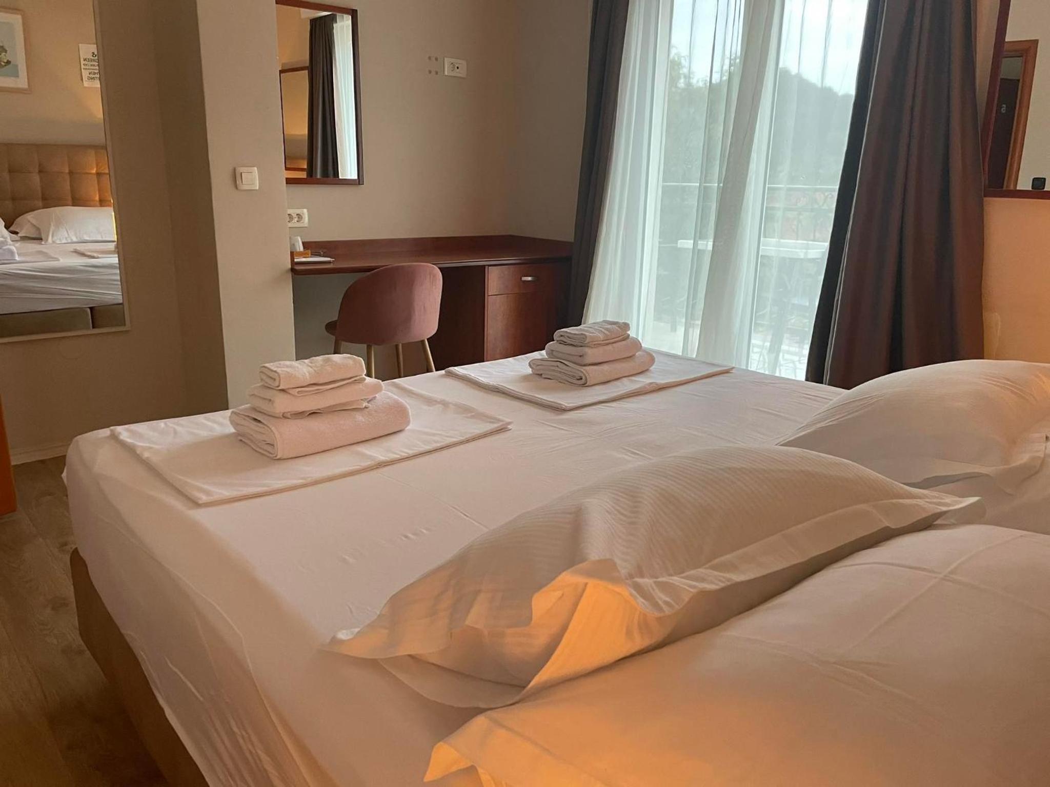 Double or Twin Room with Side Sea View photo 3