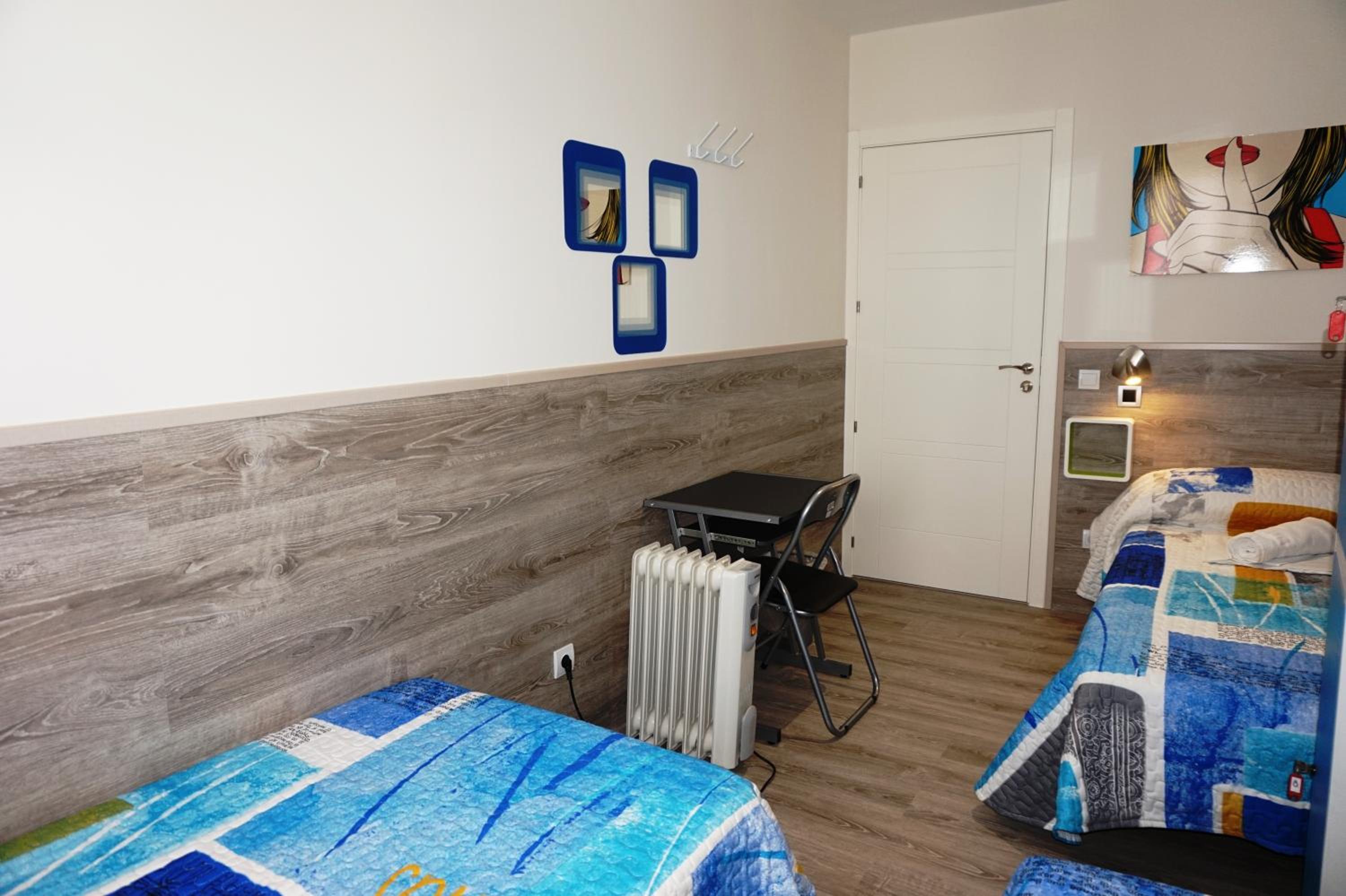 Habitación Triple con Baño Compartido